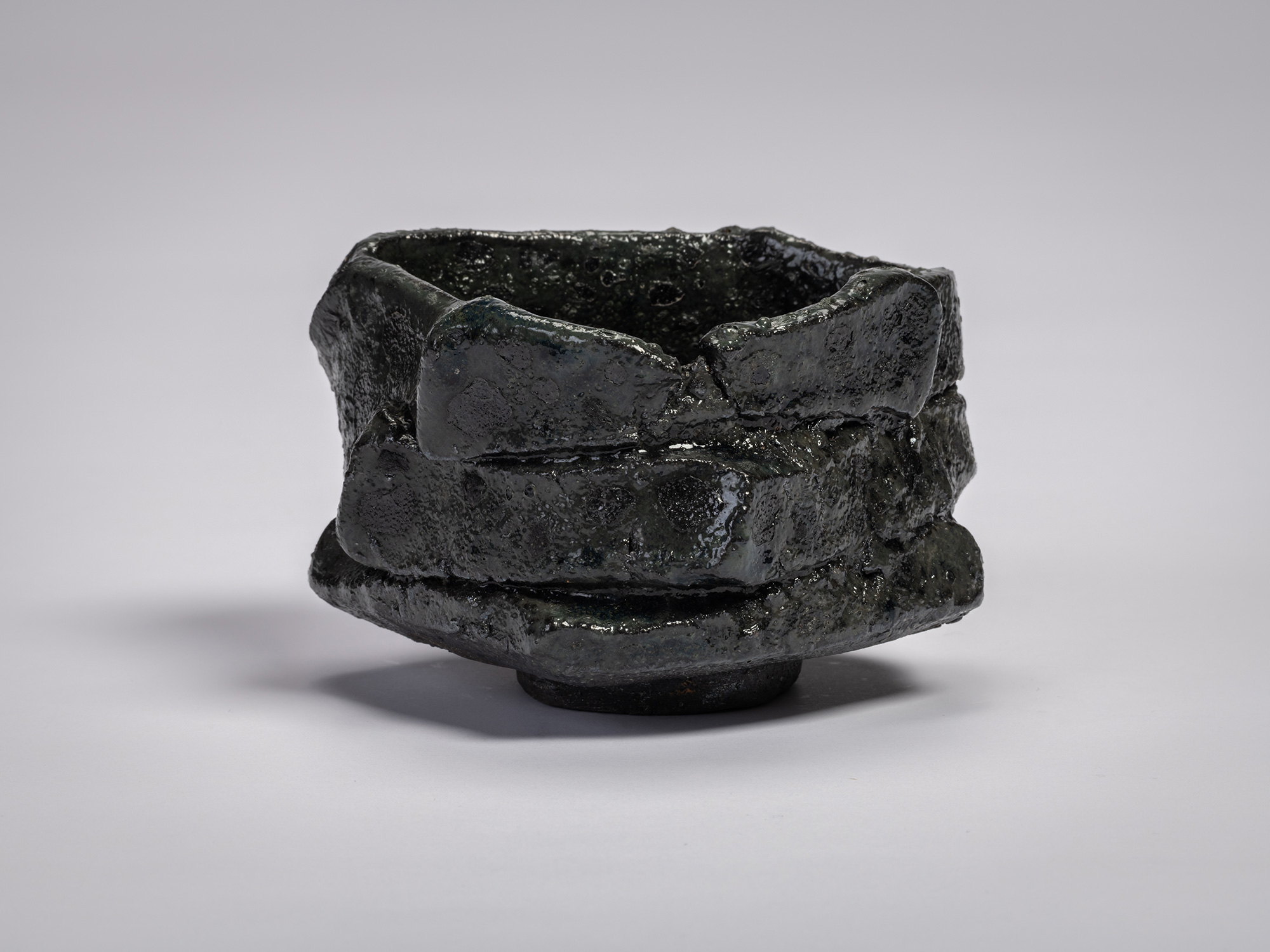 Shōzō Michikawa, Tea Bowl Black. A sculptural ceramic tea bowl with thick, irregular walls formed...