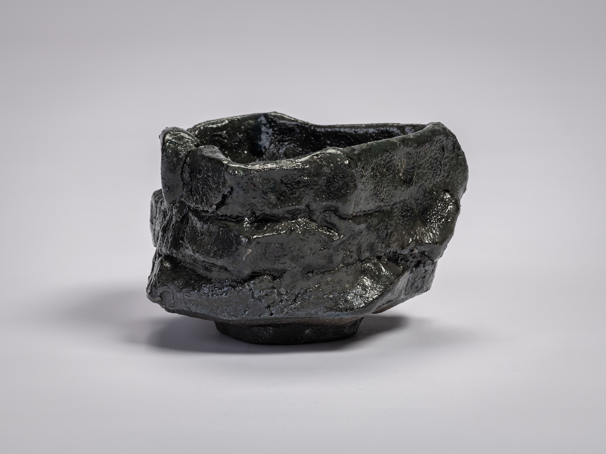 Shōzō Michikawa, Tea Bowl Black. A sculptural ceramic tea bowl with thick, irregular walls formed...