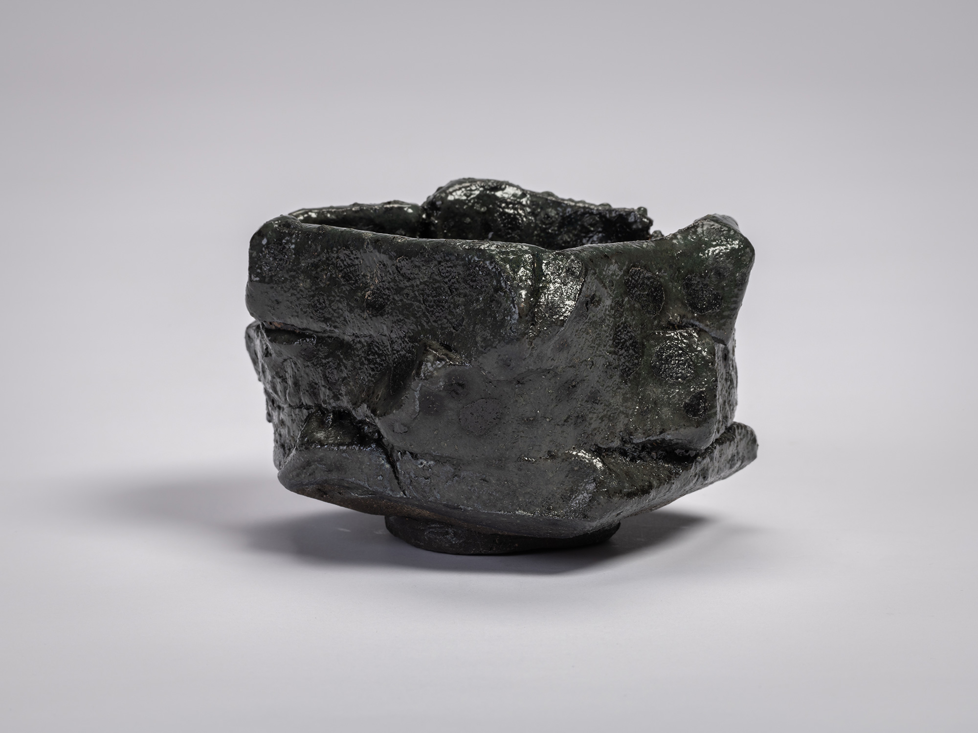 Shōzō Michikawa, Tea Bowl Black. A sculptural ceramic tea bowl with thick, irregular walls formed...
