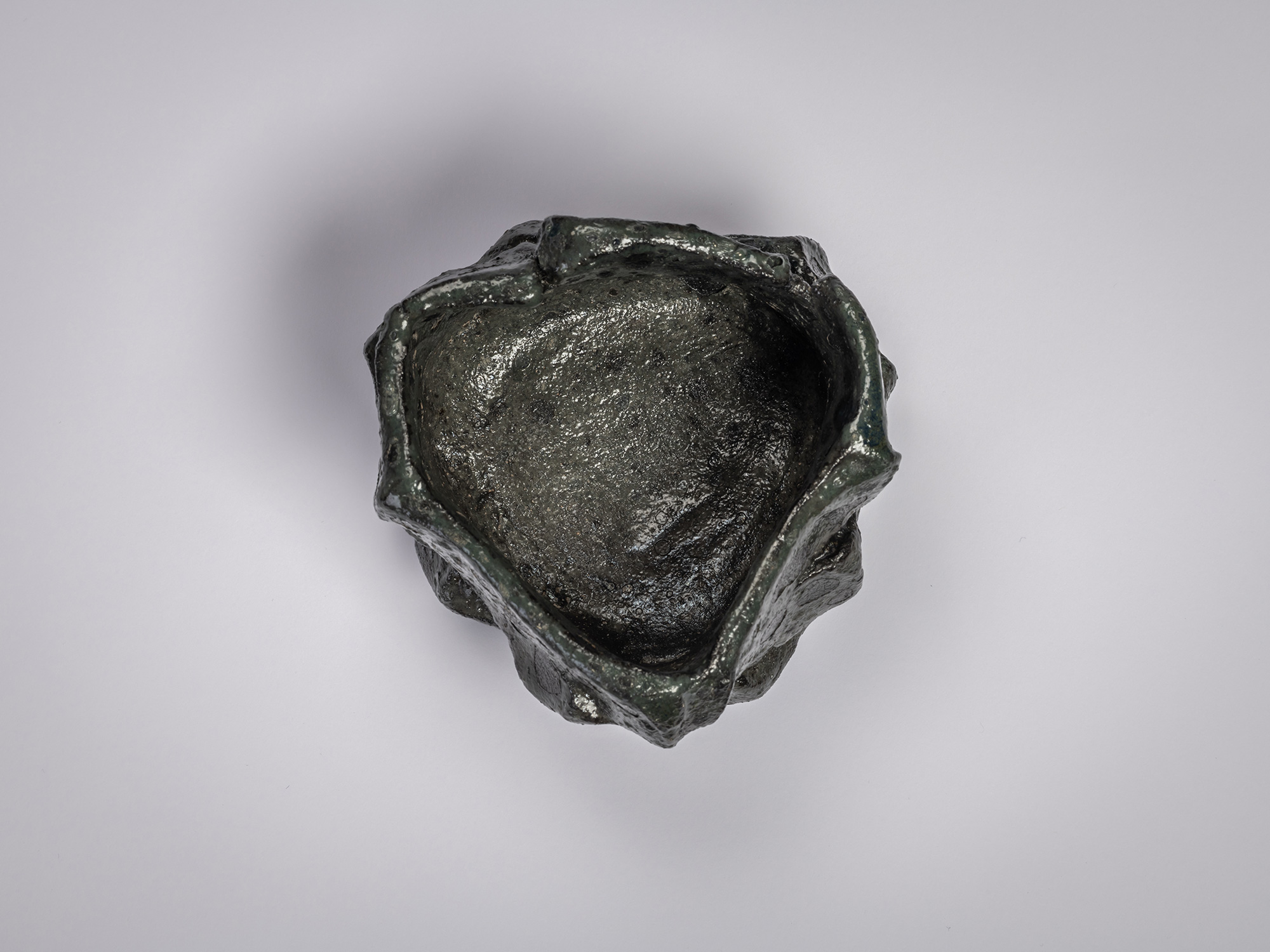 Shōzō Michikawa, Tea Bowl Black. Overhead view of a sculptural ceramic tea bowl with an irregular,...