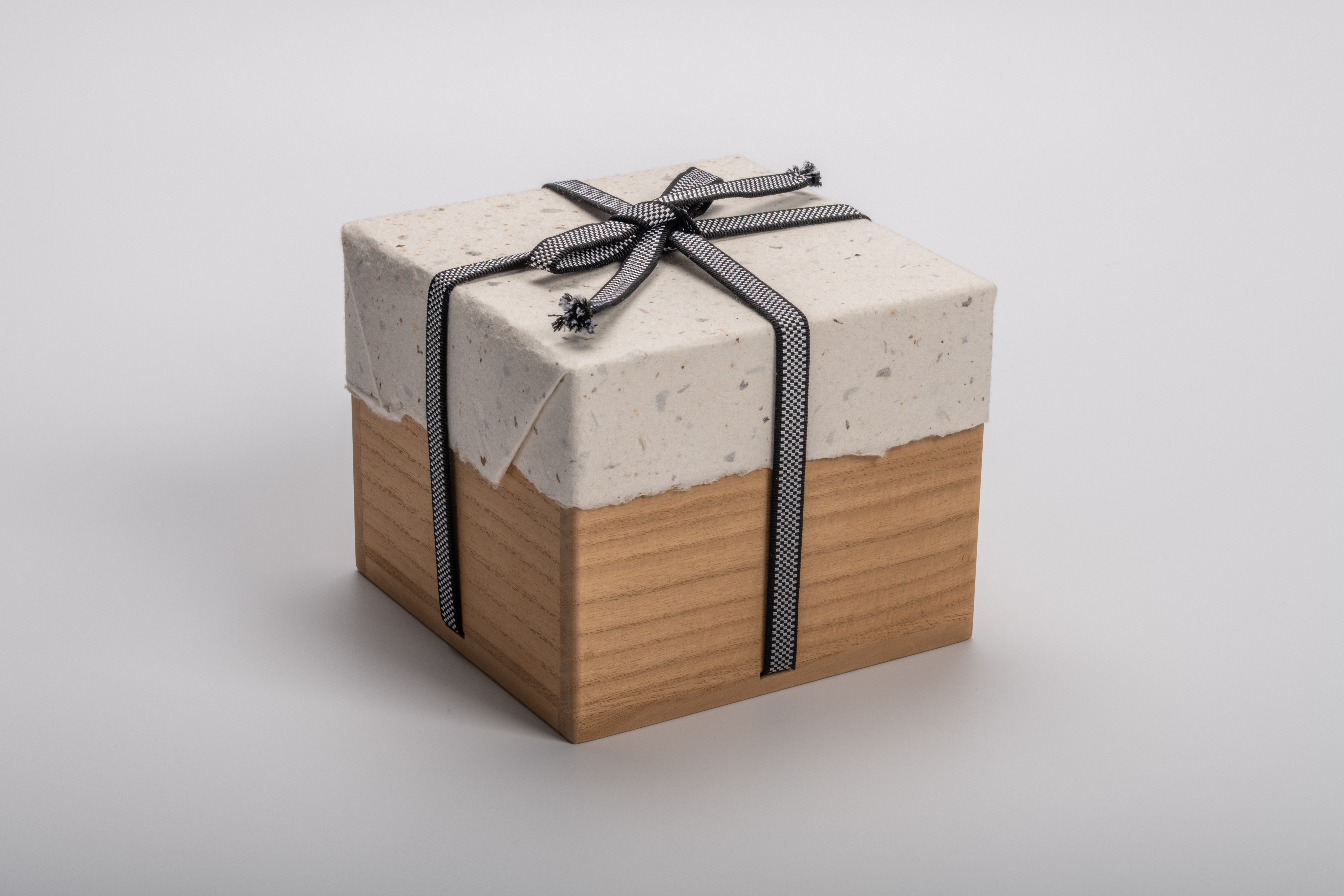 Protective wooden storage box (tomobako) for Takahiro Kondo’s “Wave Bowl: Tsunami,” wrapped in...