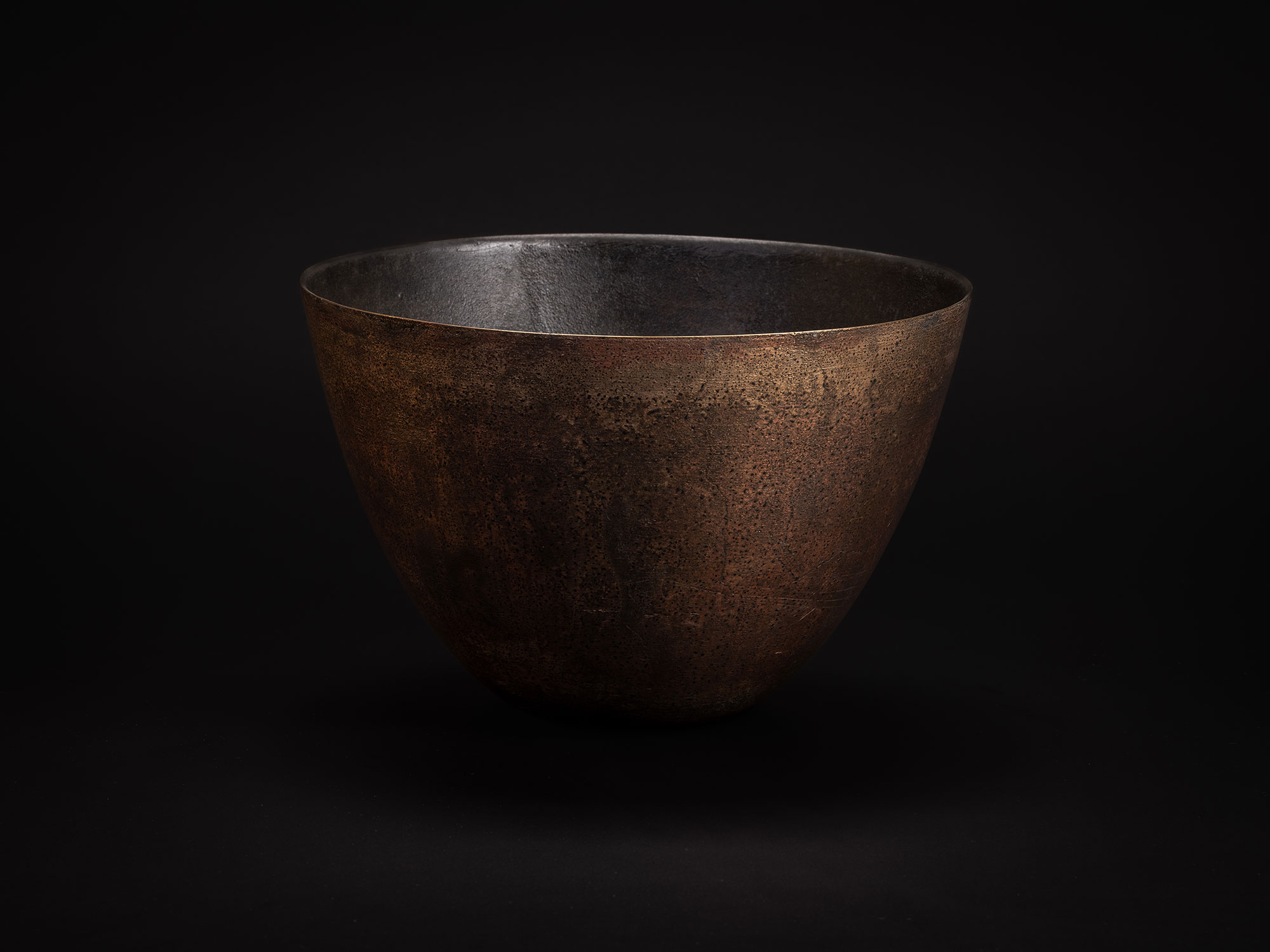 Bronze bowl by Koji Hatakeyama with a wide, open rim and gently tapering sides that curve inward...