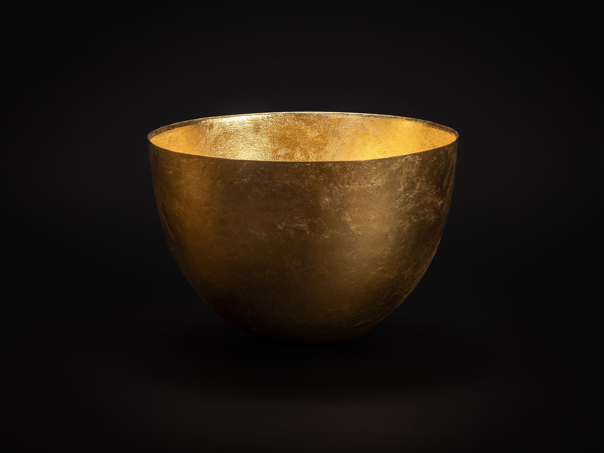 Bronze bowl by Koji Hatakeyama with a wide circular rim and gently curved sides tapering toward...