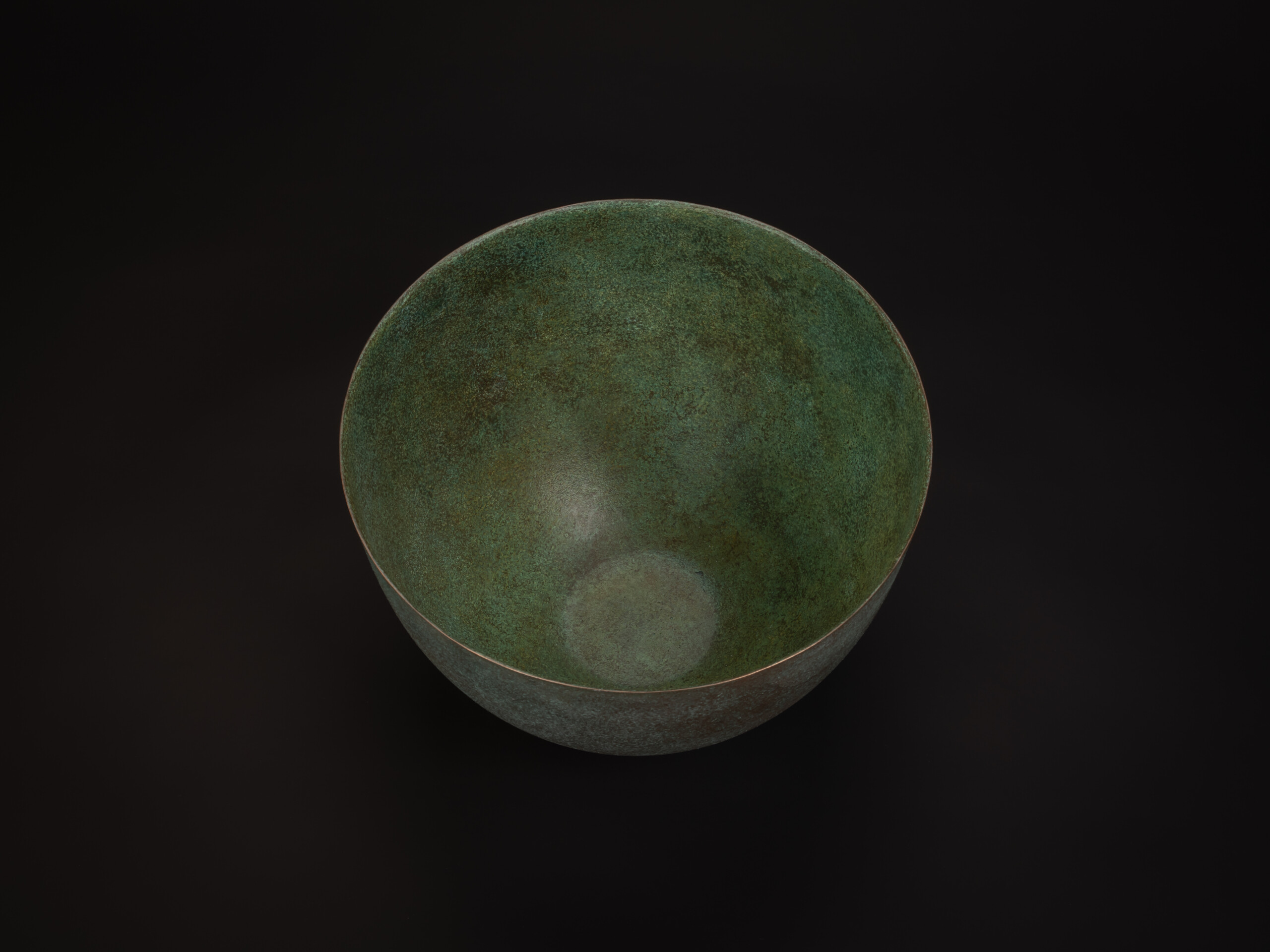 Top-down view of Bronze No. 17 by Hatakeyama, showing a wide circular opening with a thin, even...