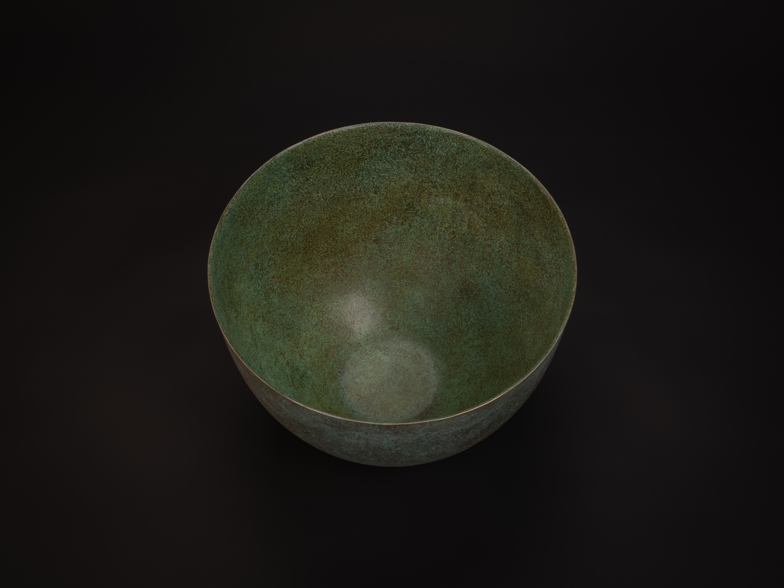 Top-down view of Bronze No. 17 by Hatakeyama, showing a wide circular opening with a thin, even...