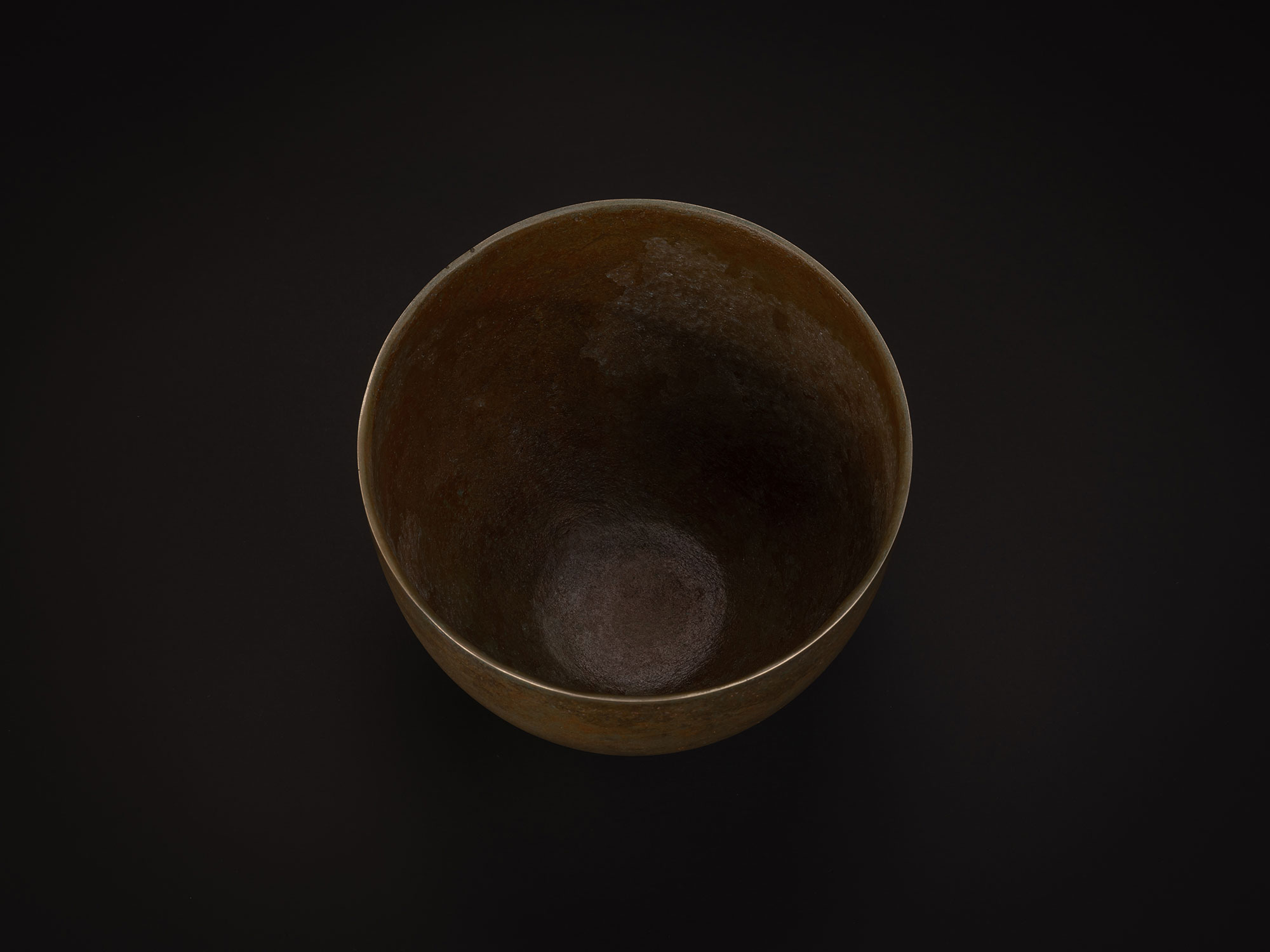 Interior view of Bronze No. 6 by Koji Hatakeyama, showing a wide circular opening and gently curving...