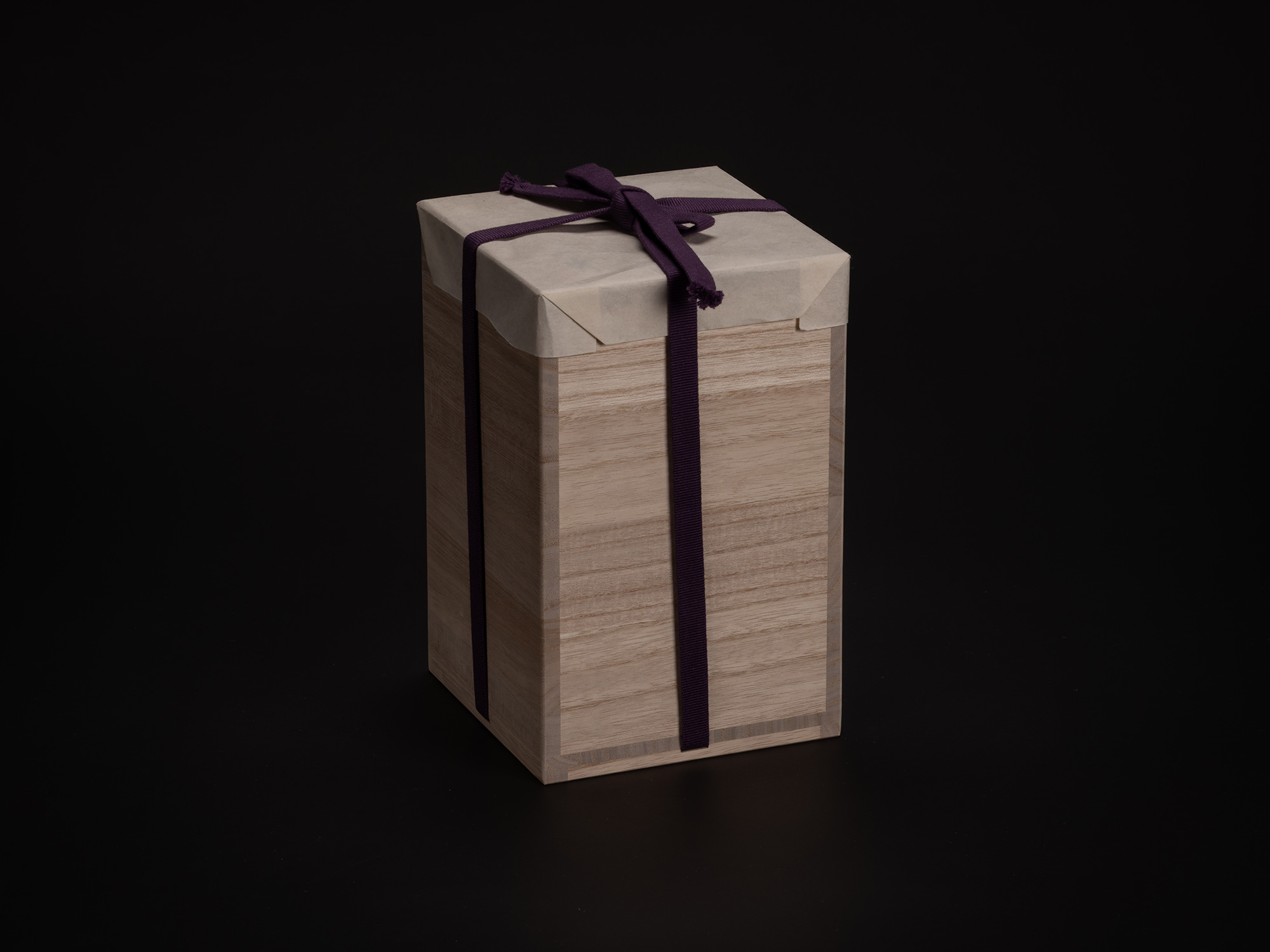 Kiri wood tomobako storage box for Nesting Covered Boxes by Akira Yagi, wrapped in white protective...