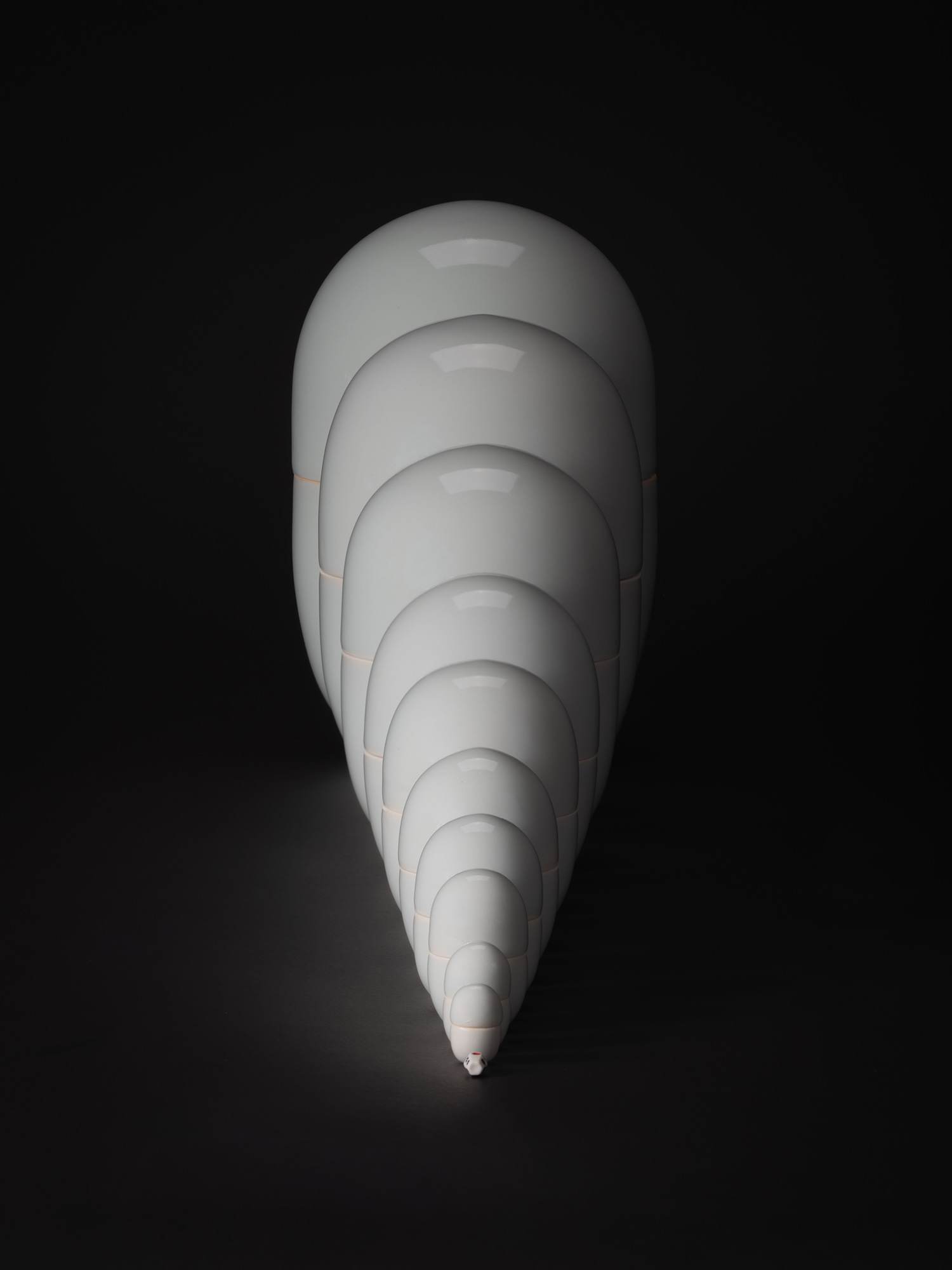 A dramatic, high-angle photograph of Nesting Covered Boxes by Japanese artist Akira Yagi. This...