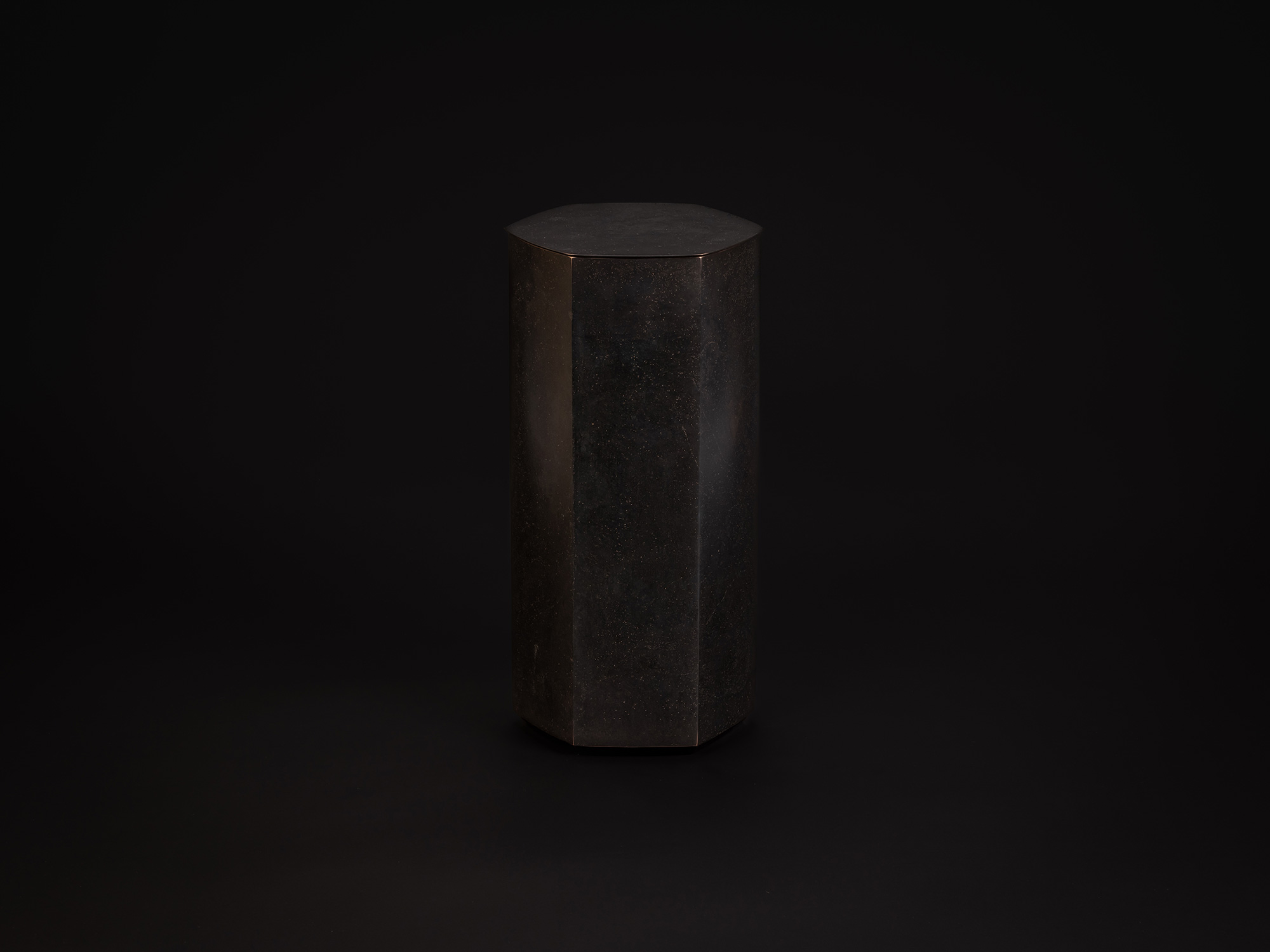 Koji Hatakeyama, Six Faces, 2024. A tall, faceted bronze vessel with six flat vertical planes forming...