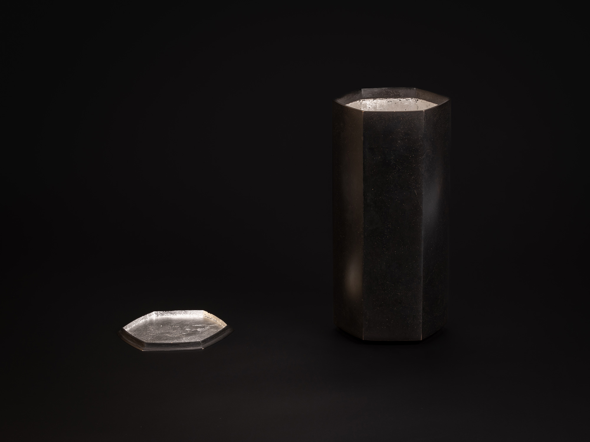 Koji Hatakeyama, Six Faces, 2024. A tall, faceted bronze vessel with six flat vertical planes forming...