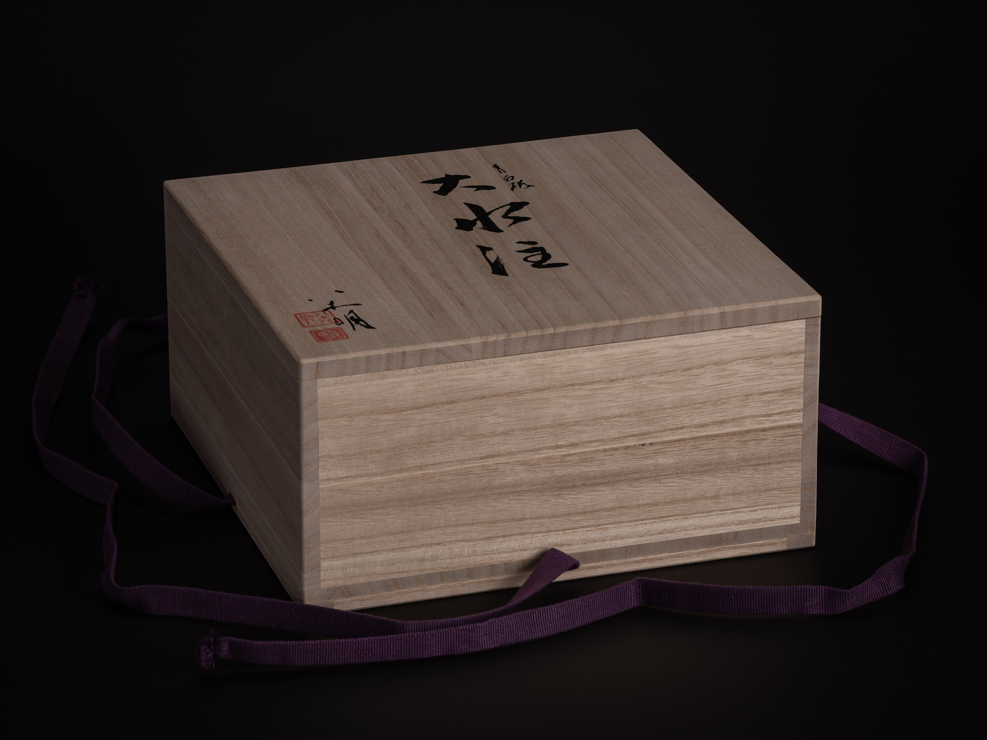 A studio photograph of the tomobako (traditional Japanese wooden storage box) for the artwork Water...