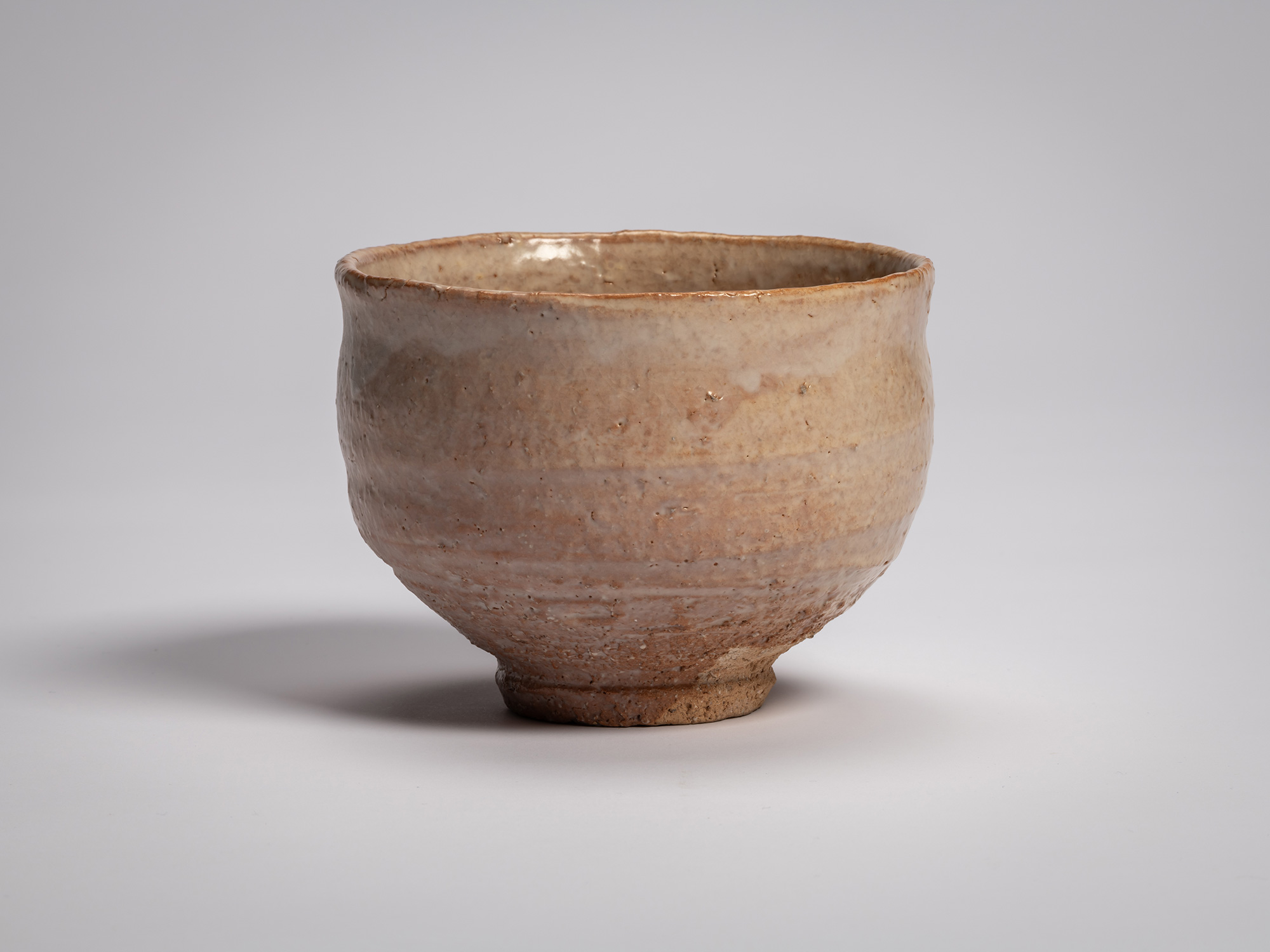 Hagi chawan (tea bowl) by Miwa X, a rounded ceramic bowl with a gently flared rim and slightly...