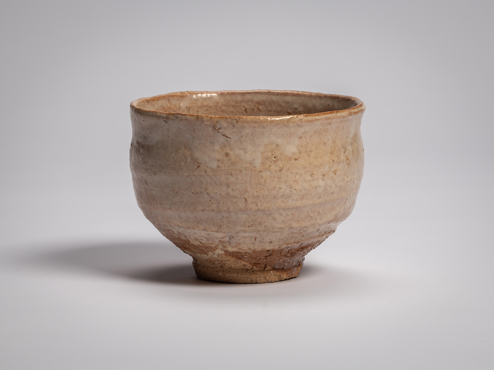 Hagi chawan (tea bowl) by Miwa X, a rounded ceramic bowl with a gently flared rim and slightly...