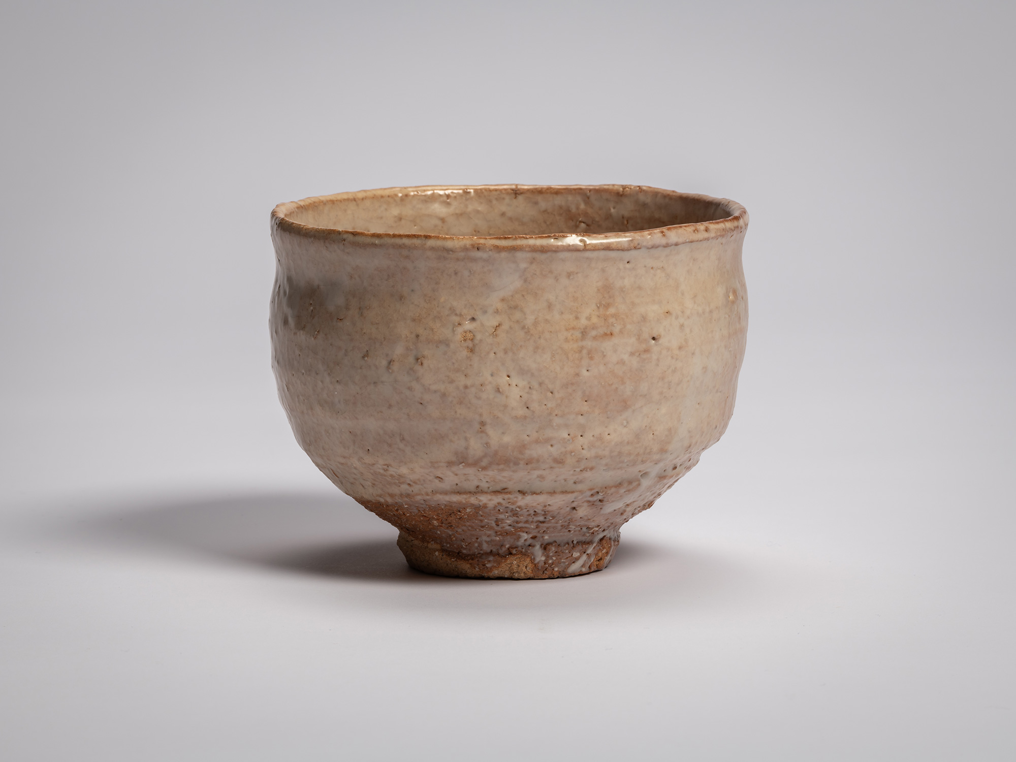 Hagi chawan (tea bowl) by Miwa X, a rounded ceramic bowl with a gently flared rim and slightly...