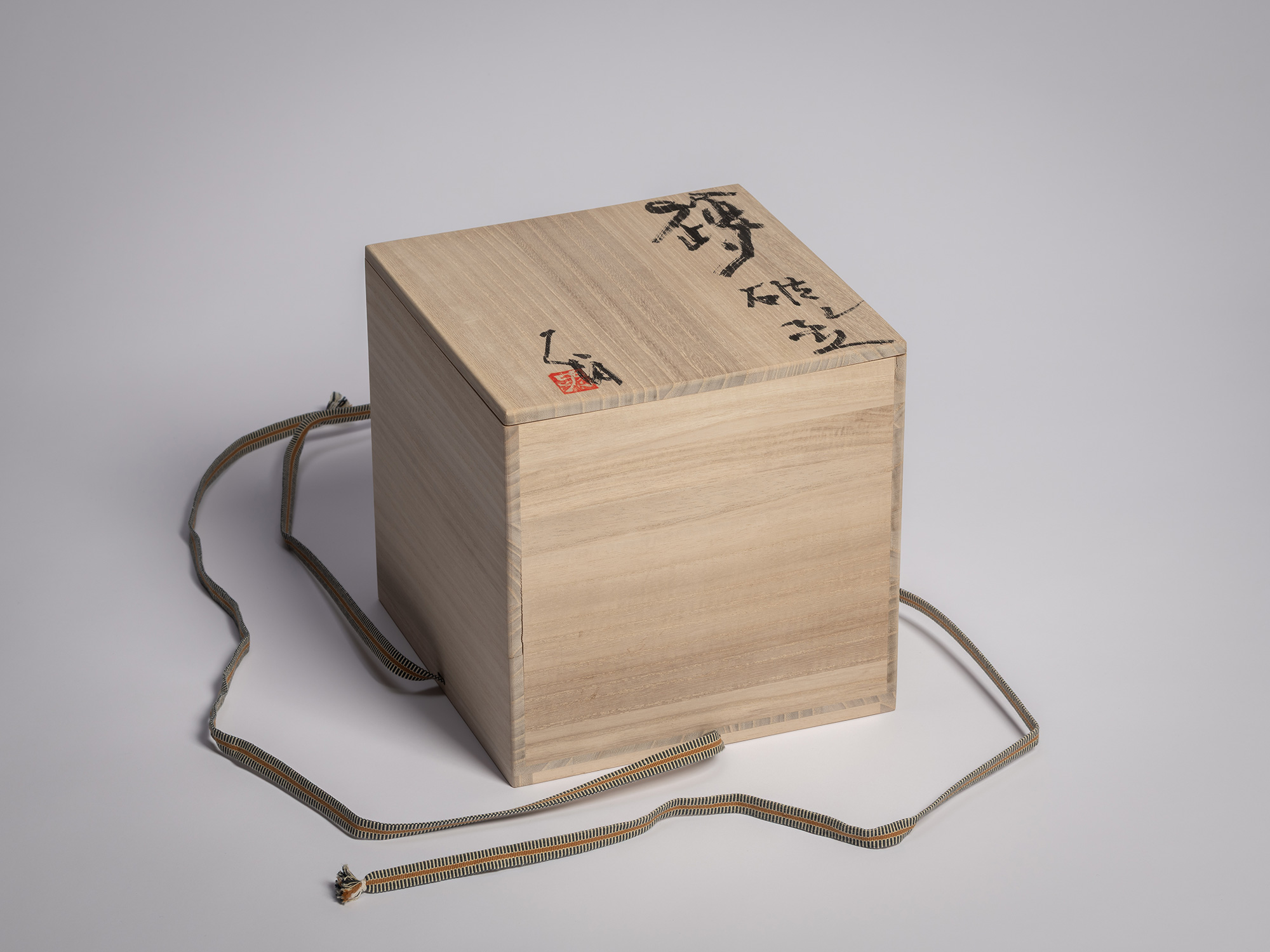 Tomobako (wooden storage box) for Iga Broken Jar by Shiro Tsujimura, shown with lid inscribed in...