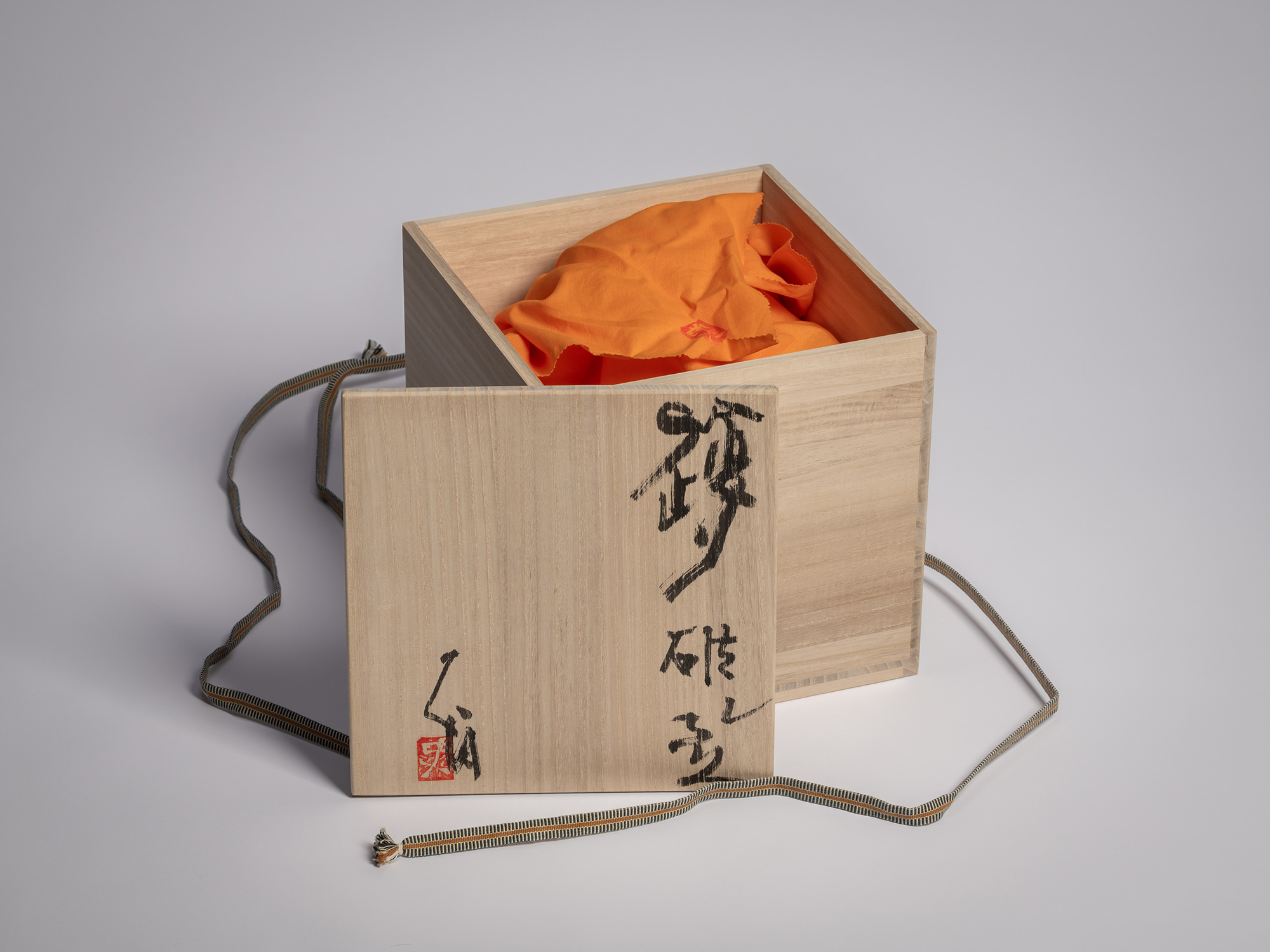 Open tomobako (wooden storage box) for Iga Broken Jar by Shiro Tsujimura, showing the lid inscribed...