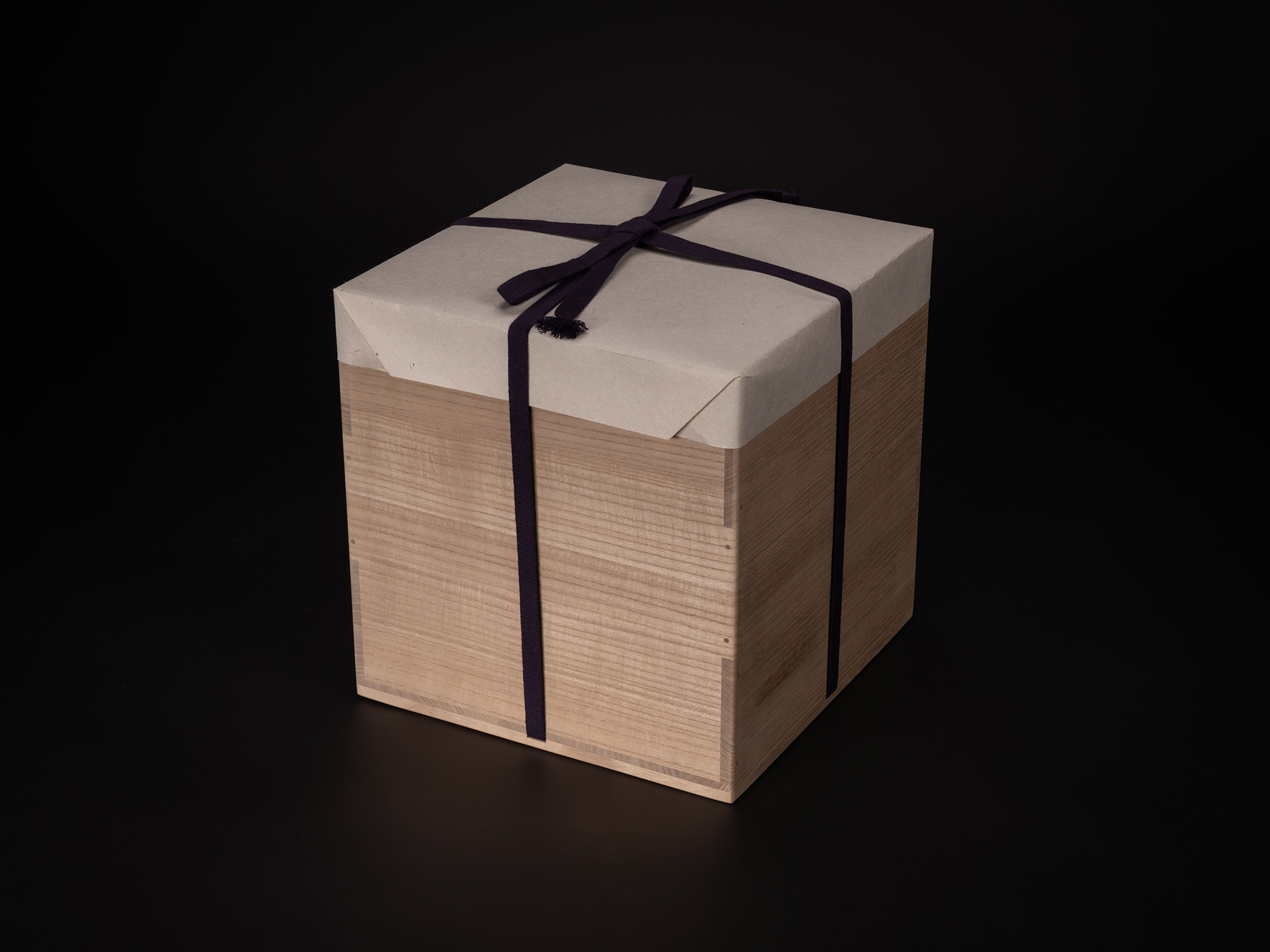 Wooden tomobako storage box for Kayō (Architectural Vessel) by Masamichi Yoshikawa, wrapped in...