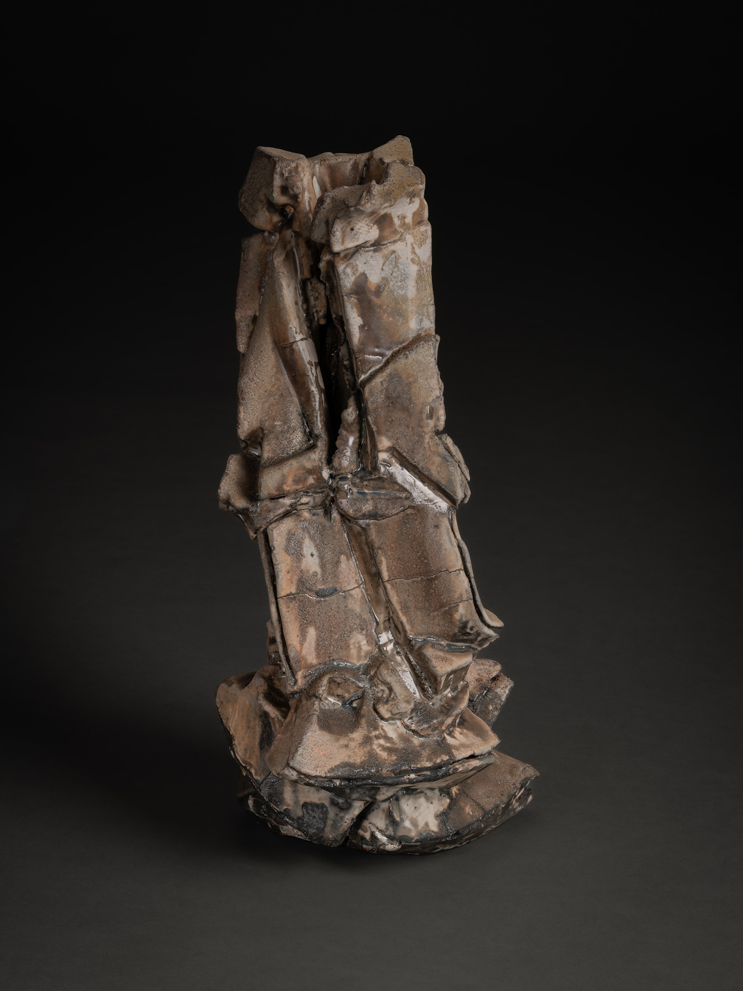 Vertical ceramic sculpture by Shōzō Michikawa featuring angular, folded planes and compressed forms,...