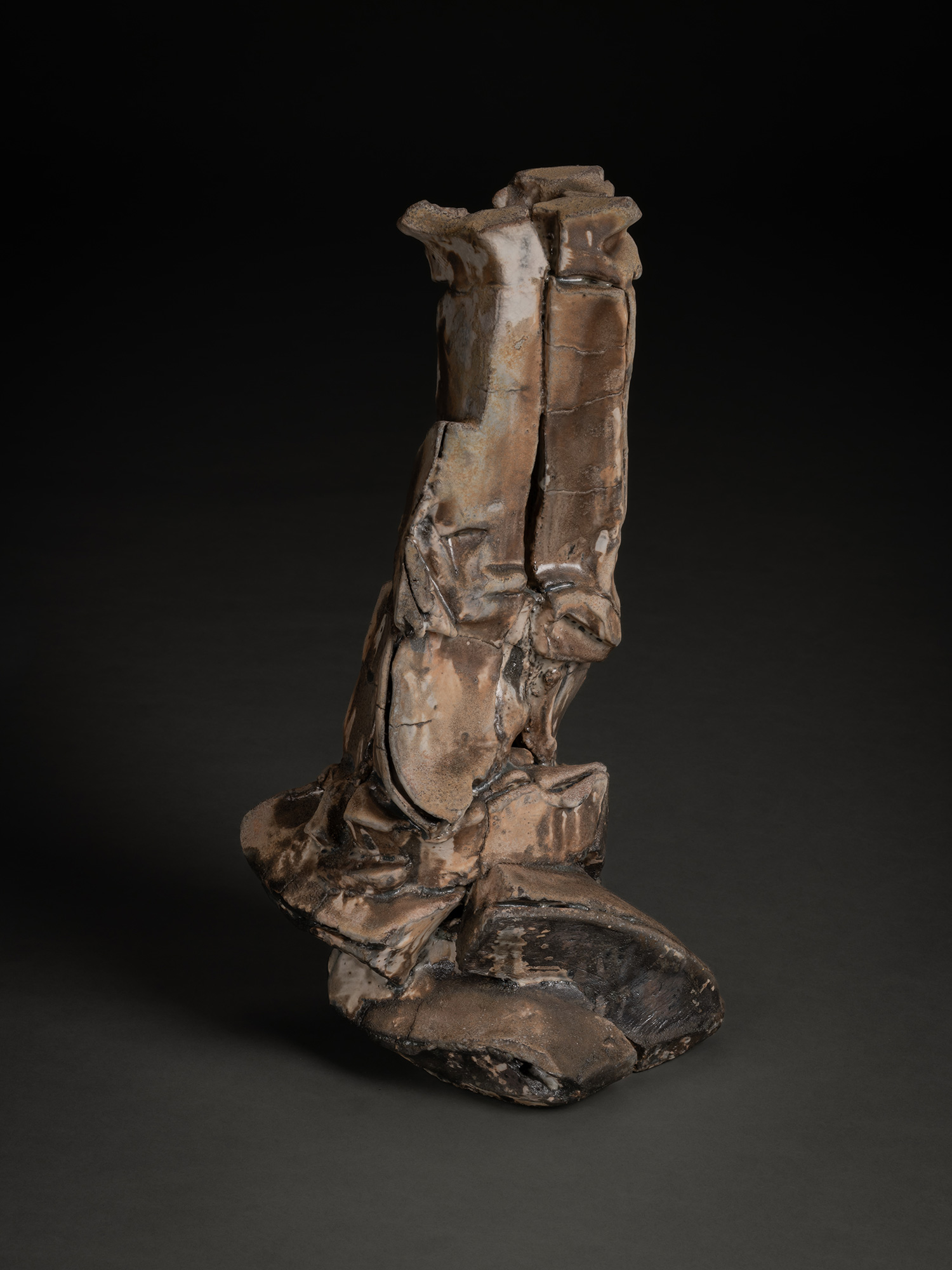 Vertical ceramic sculpture by Shōzō Michikawa featuring angular, folded planes and compressed forms,...