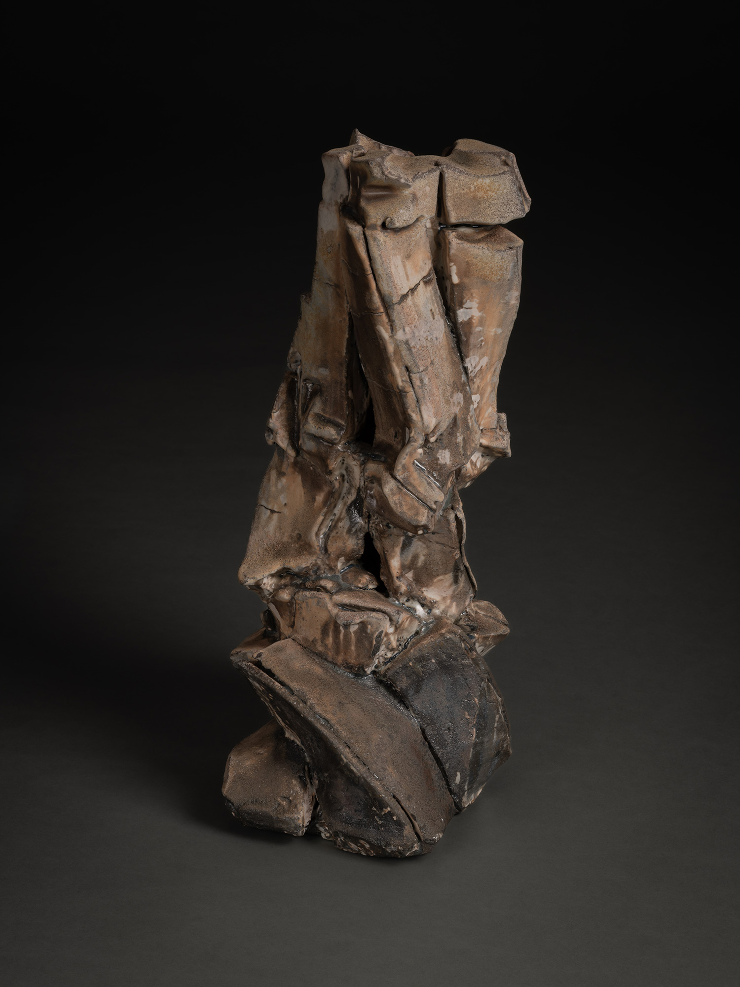Vertical ceramic sculpture by Shōzō Michikawa featuring angular, folded planes and compressed forms,...
