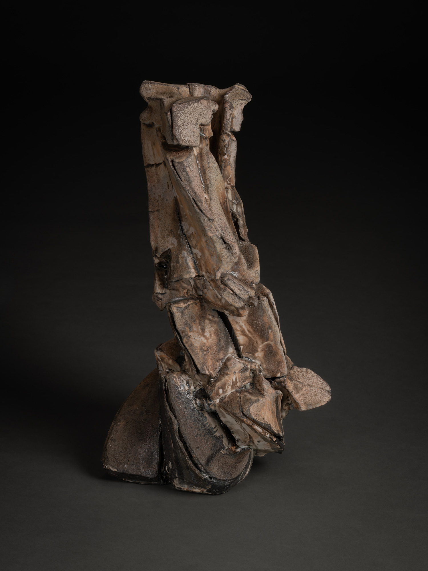 Vertical ceramic sculpture by Shōzō Michikawa featuring angular, folded planes and compressed forms,...