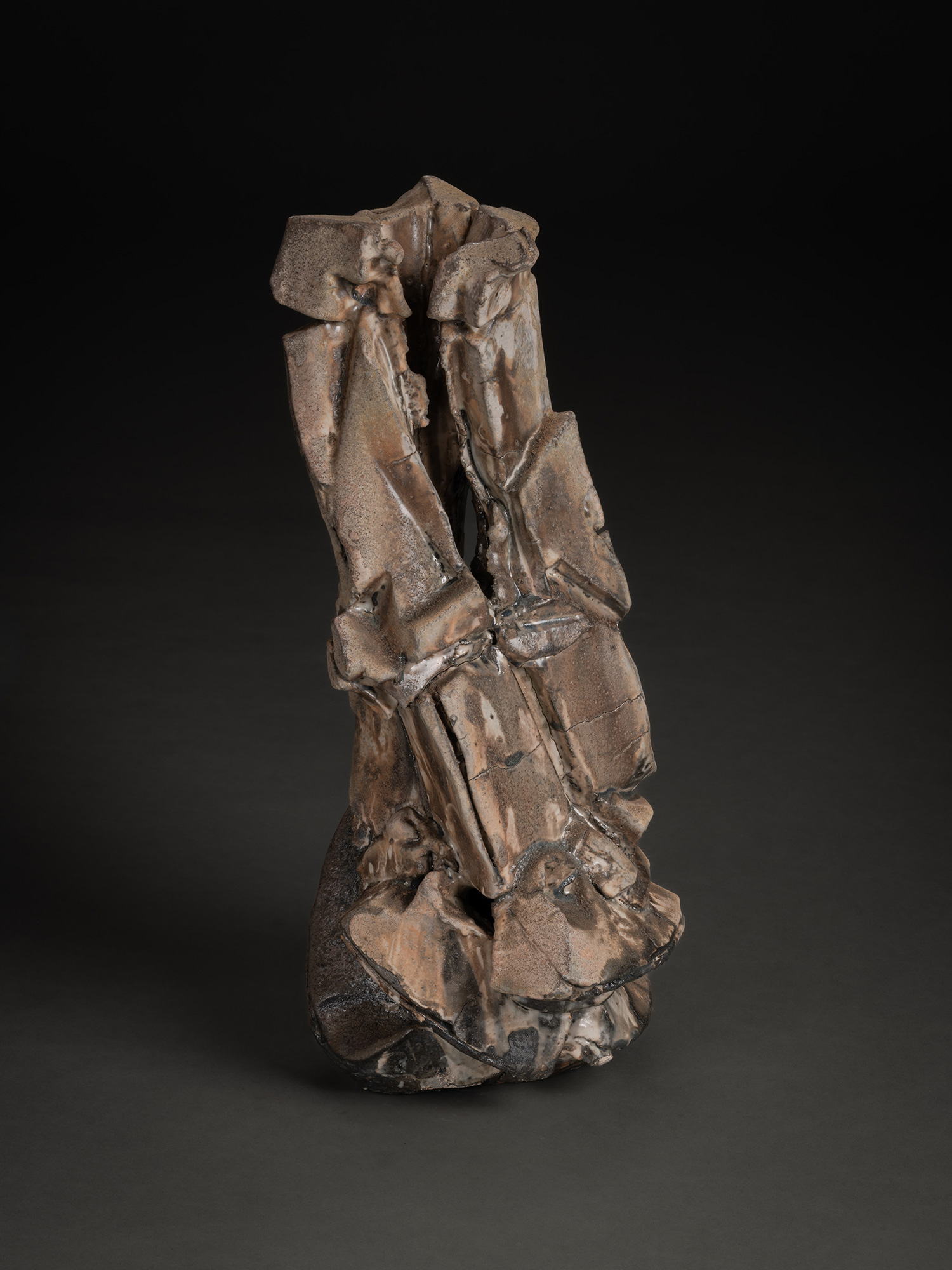 Vertical ceramic sculpture by Shōzō Michikawa featuring angular, folded planes and compressed forms,...