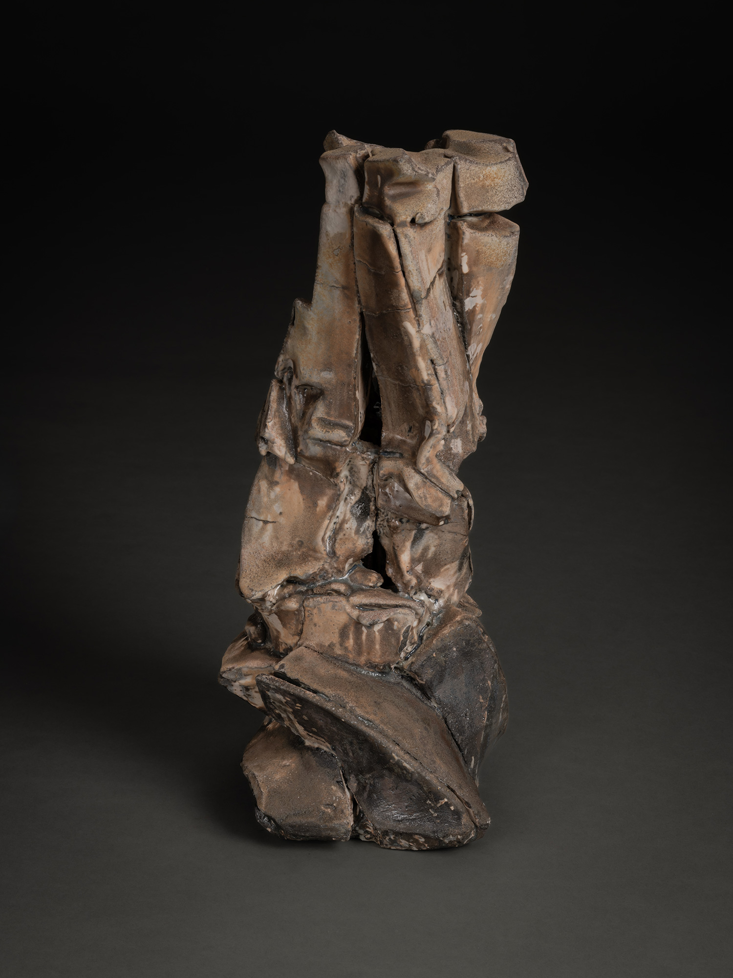 Vertical ceramic sculpture by Shōzō Michikawa featuring angular, folded planes and compressed forms,...