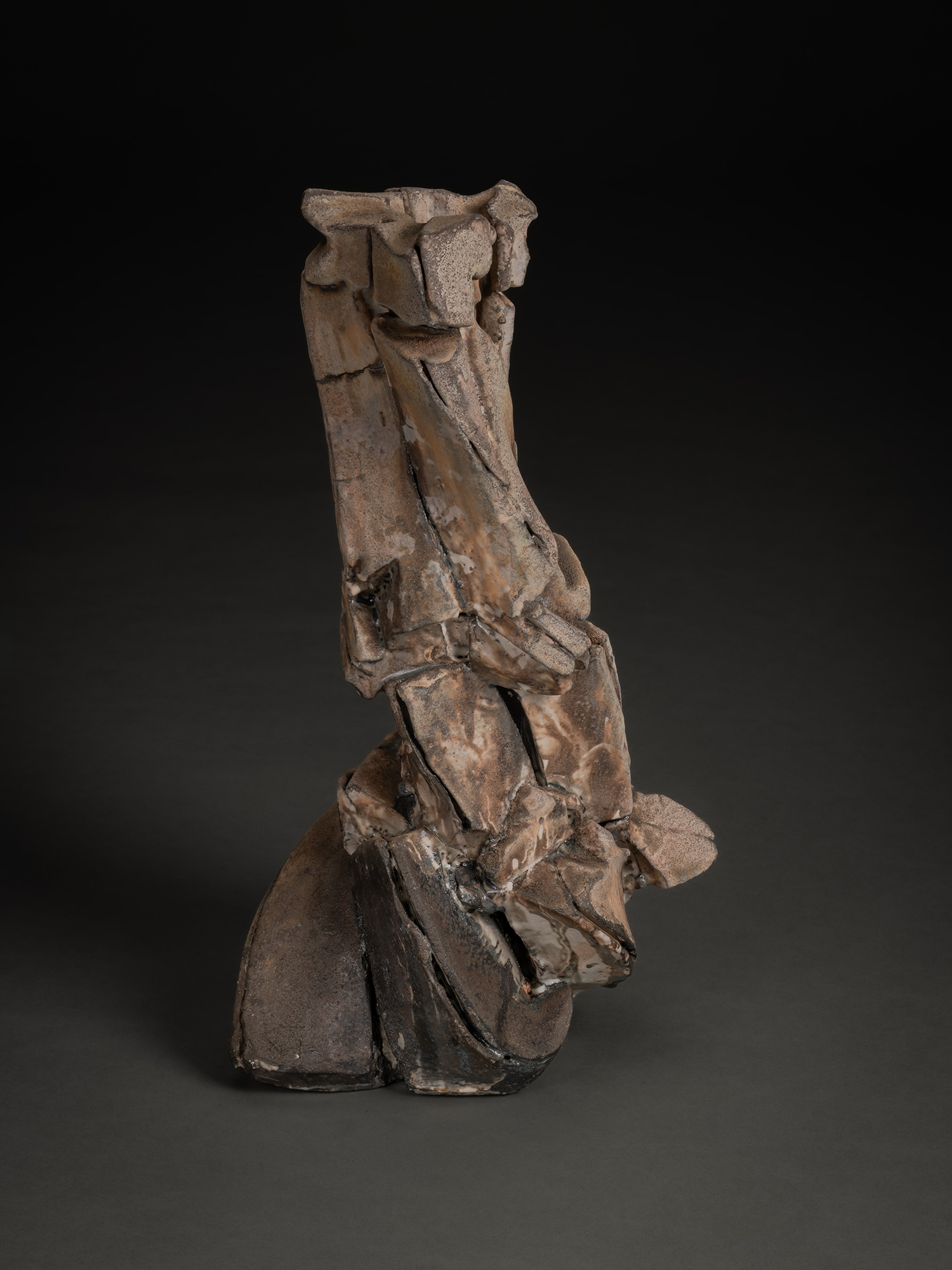Vertical ceramic sculpture by Shōzō Michikawa featuring angular, folded planes and compressed forms,...