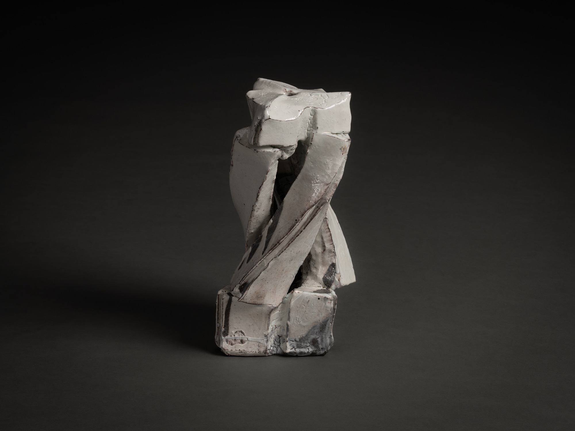 Kohiki Sculptural Form by Michikawa is a small ceramic sculpture with a twisting, vertical composition,...