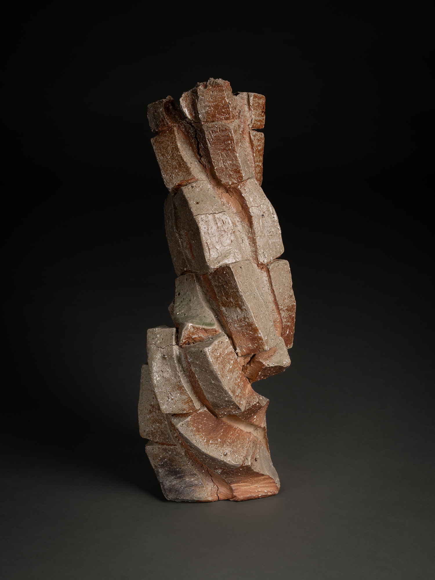 Natural ash sculptural form by Shōzō Michikawa, an upright, twisting ceramic structure composed...