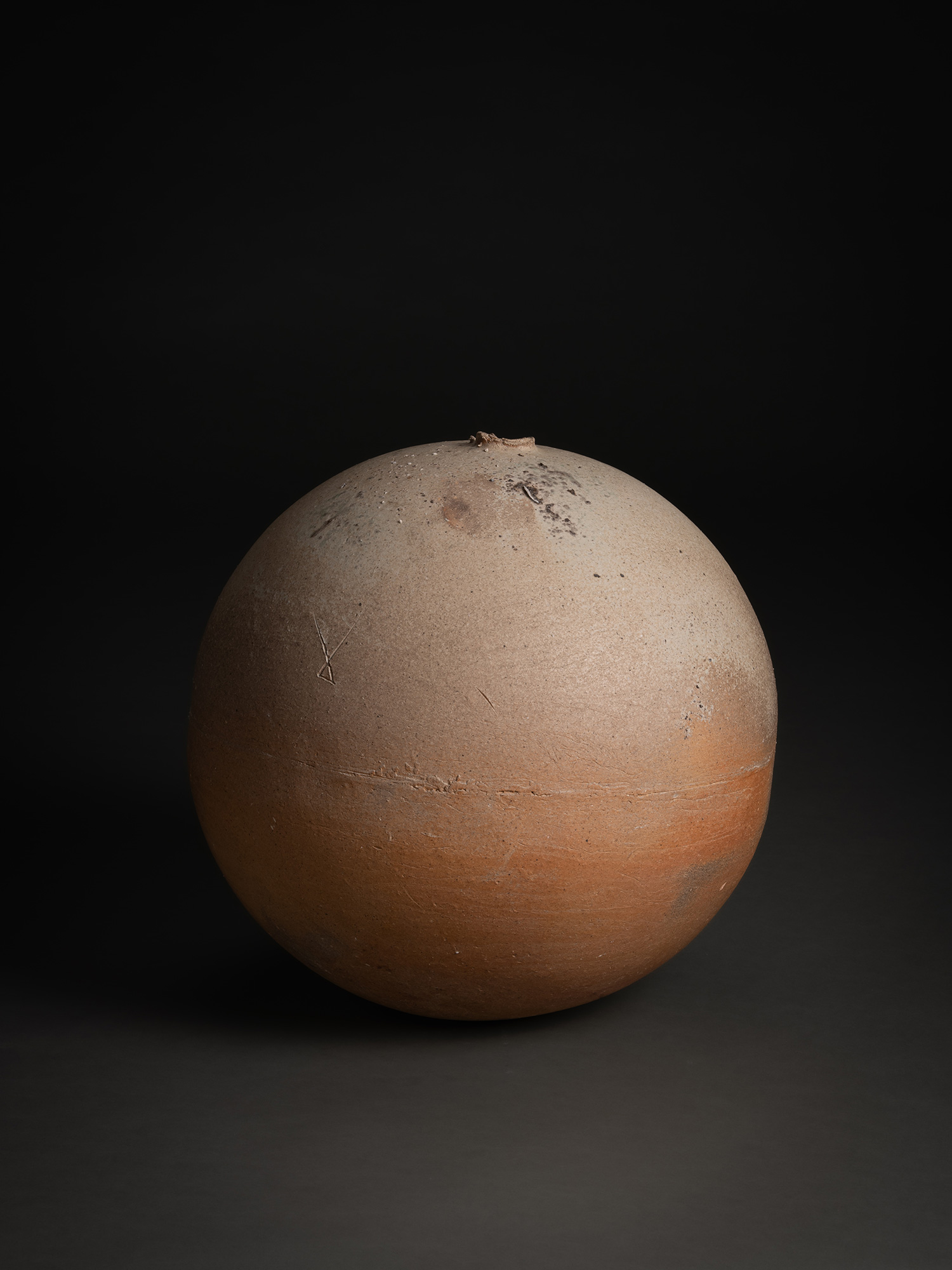 Sphere by Tsujimura, a hand-formed ceramic with a rounded, near-spherical shape, shown against...