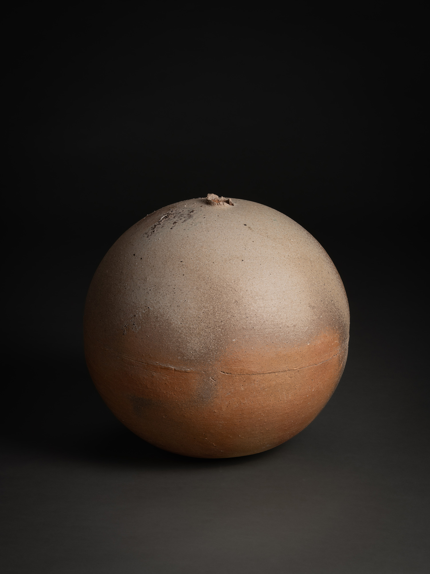 Sphere by Tsujimura, a hand-formed ceramic with a rounded, near-spherical shape, shown against...