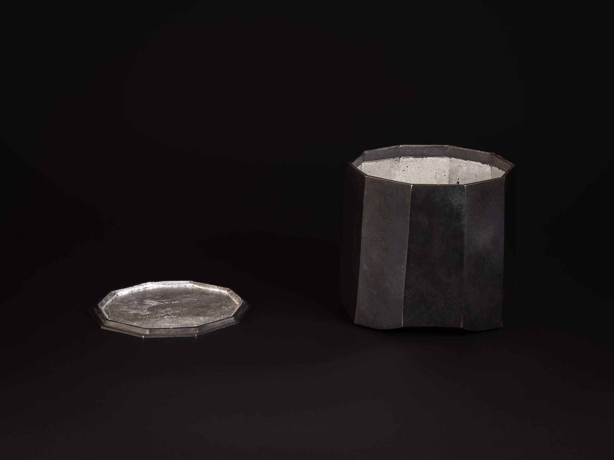Faceted bronze vessel with ten sides that slightly taper inward entitled Ten Faces II by Koji Hatakeyama,...