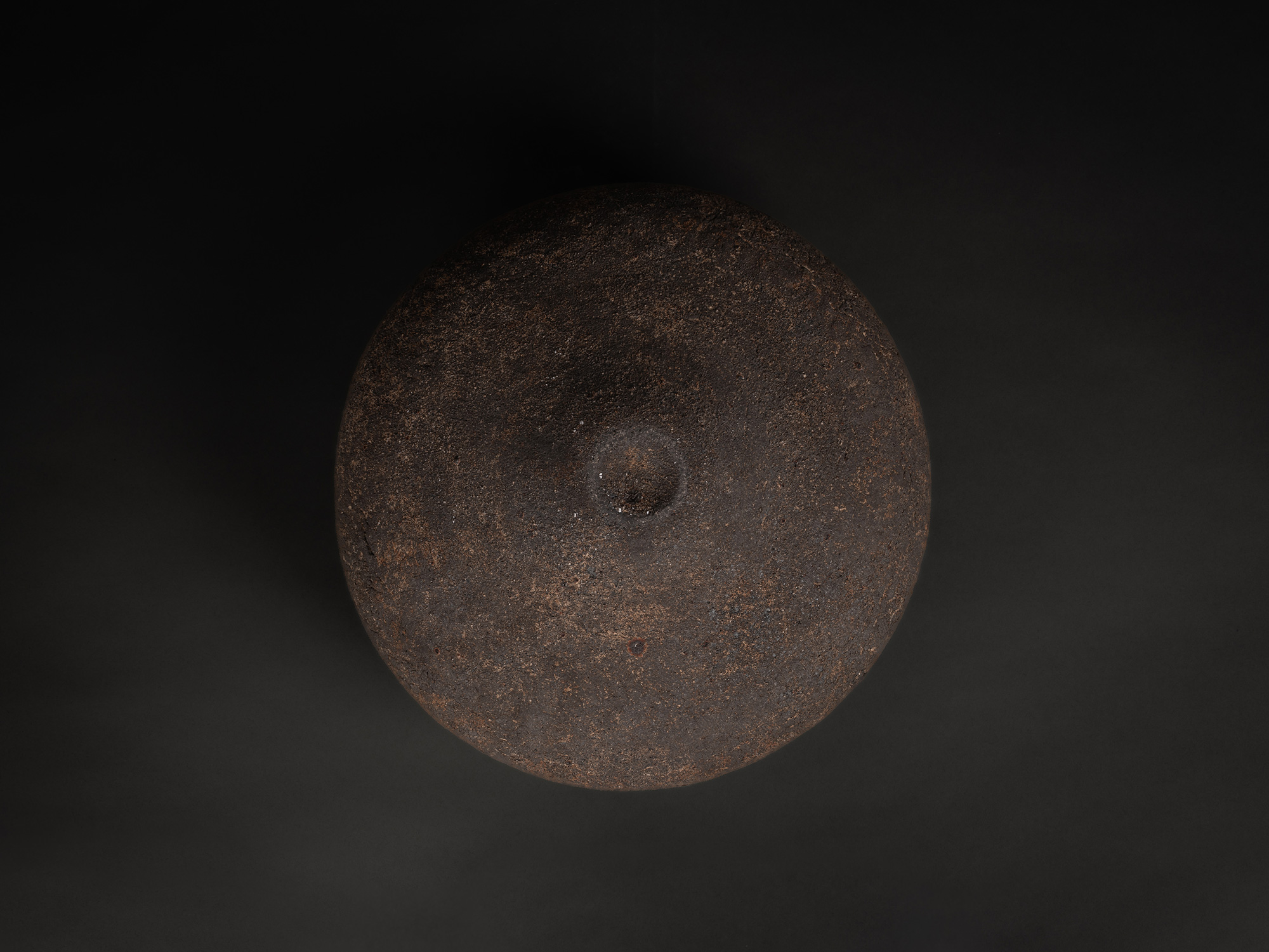 View of foot of the vase by Jun Aoki, showing a broad, circular base with a gently recessed center...