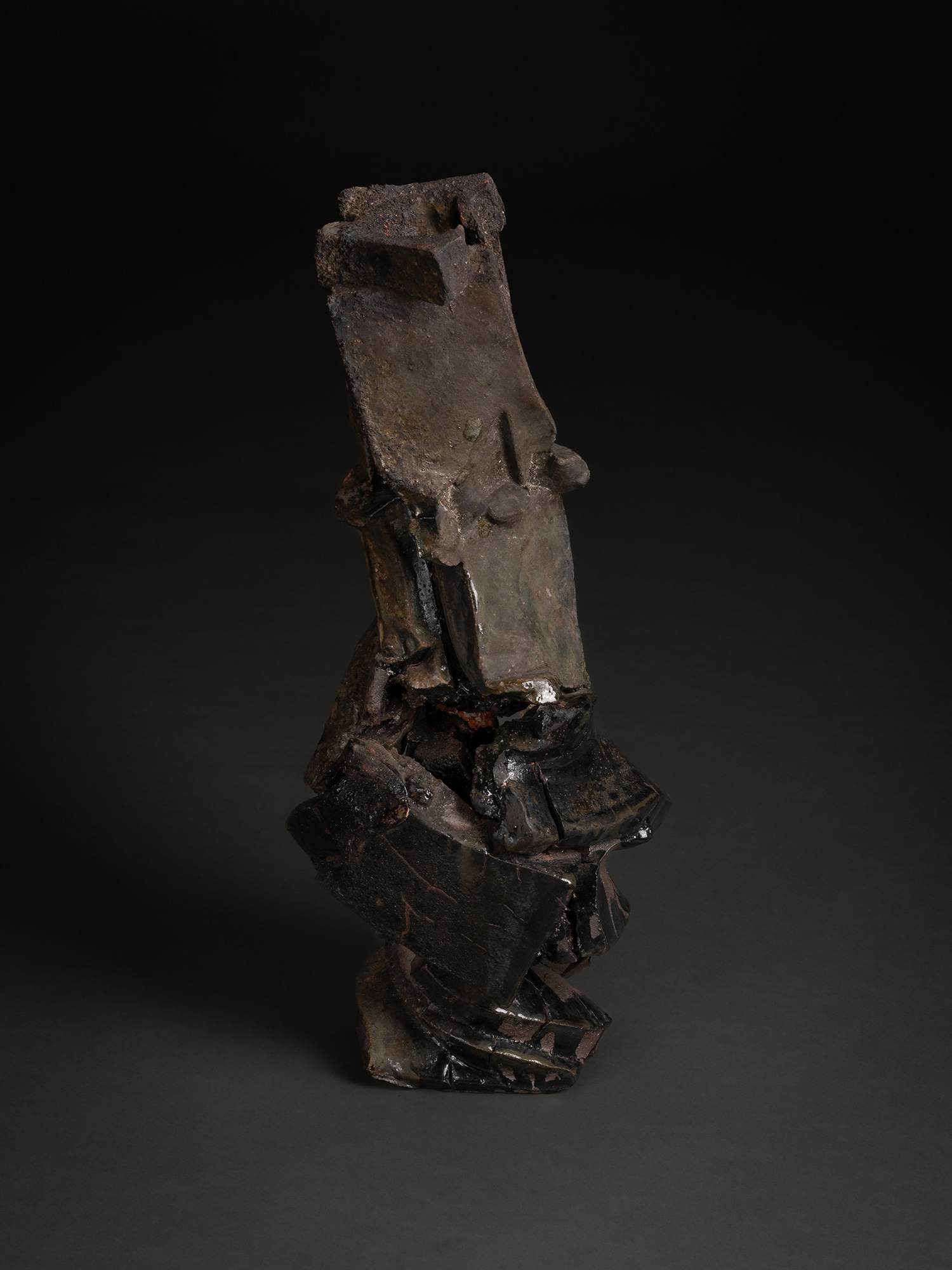 Vertical ceramic sculpture titled Volcano by Shōzō Michikawa, composed of stacked, fractured planes...