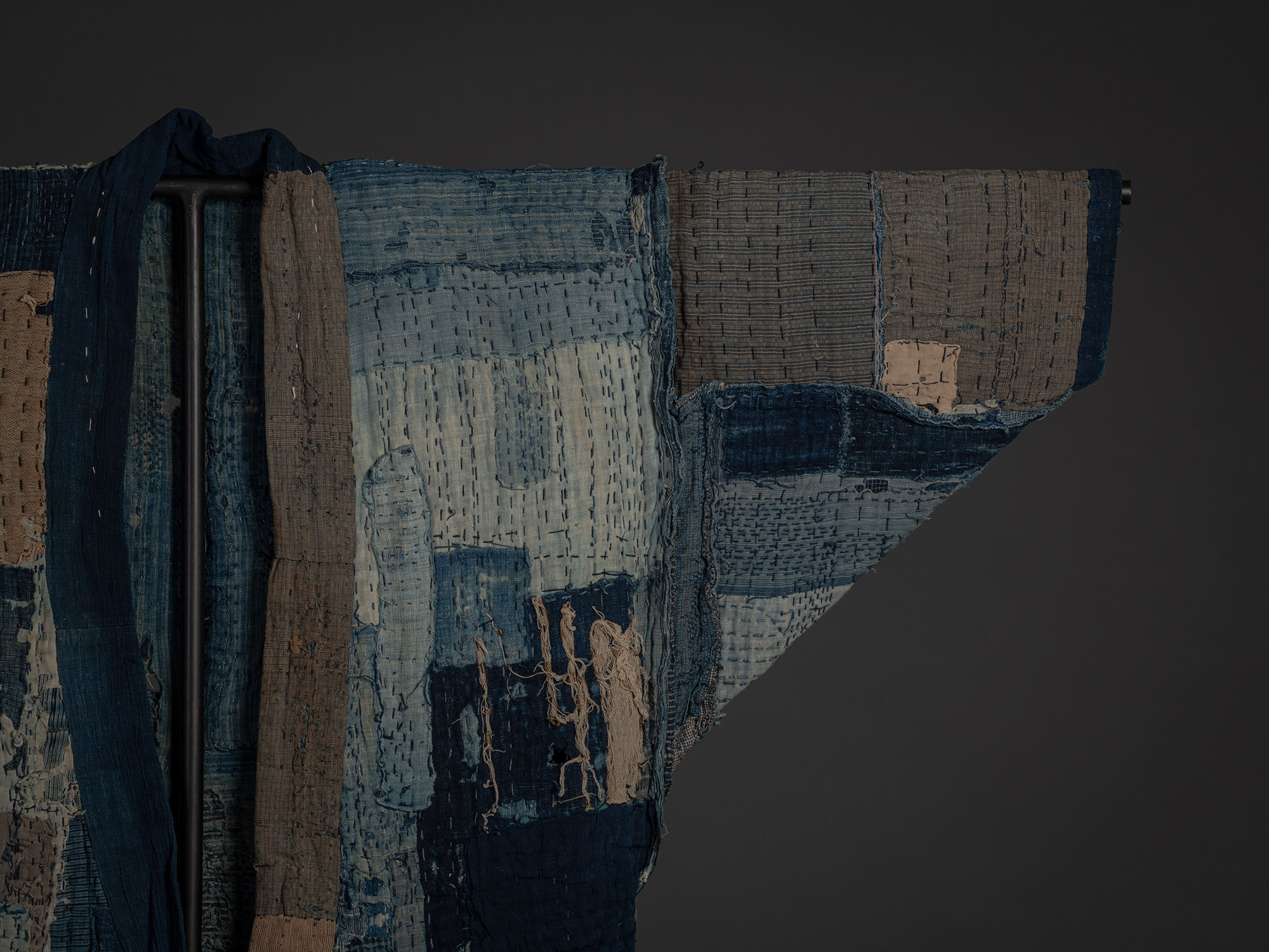 Close-up of the right shoulder and sleeve of a late 19th–early 20th century Japanese boro kimono....