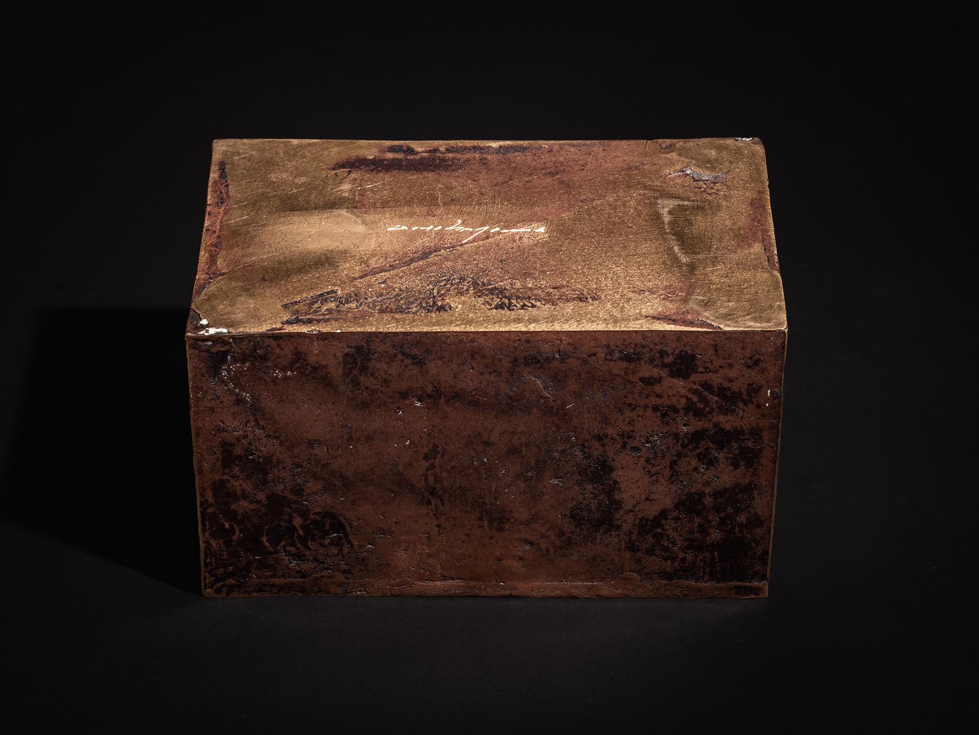 The underside view of the bronze box Doing Little - Small by Koji Hatakeyama, documented against...