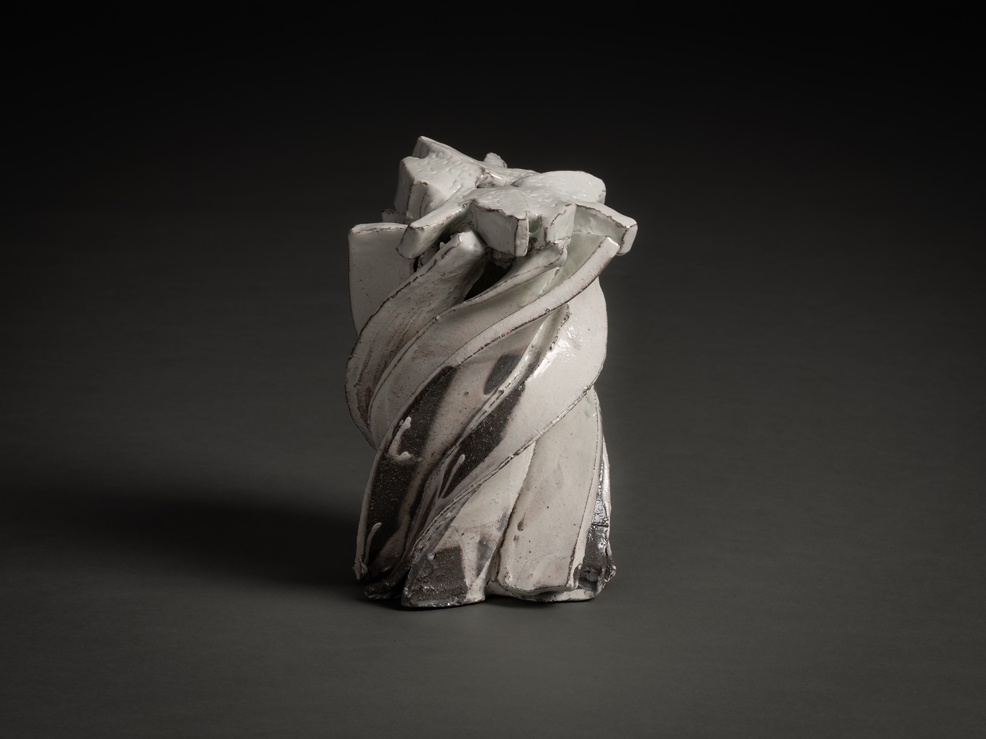 Kohiki Sculptural Form by Shōzō Michikawa is a vertically twisting ceramic sculpture with layered...