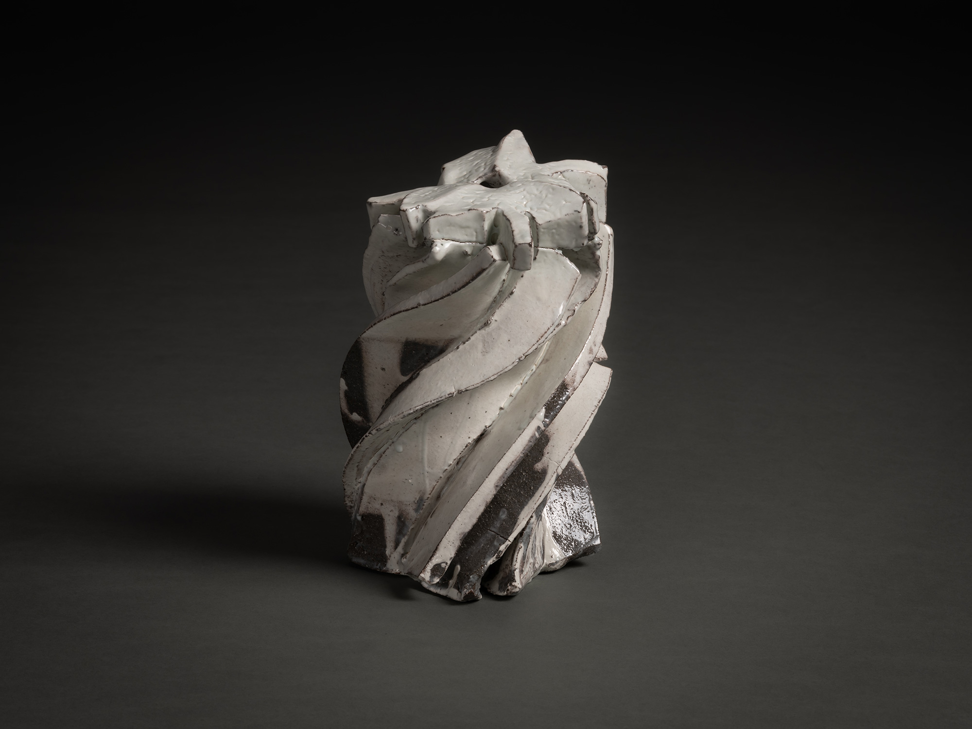 Kohiki Sculptural Form by Shōzō Michikawa is a vertically twisting ceramic sculpture with layered...