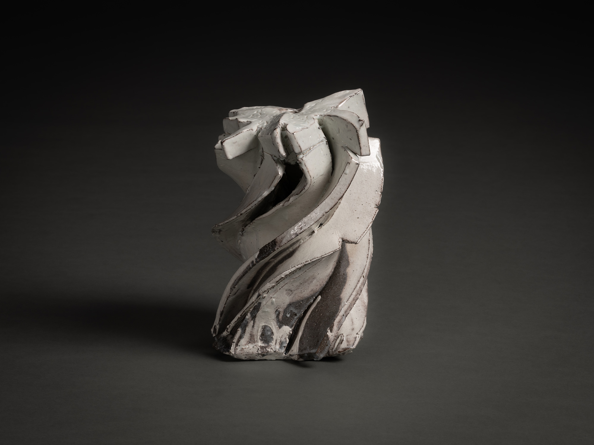 Kohiki Sculptural Form by Shōzō Michikawa is a vertically twisting ceramic sculpture with layered...