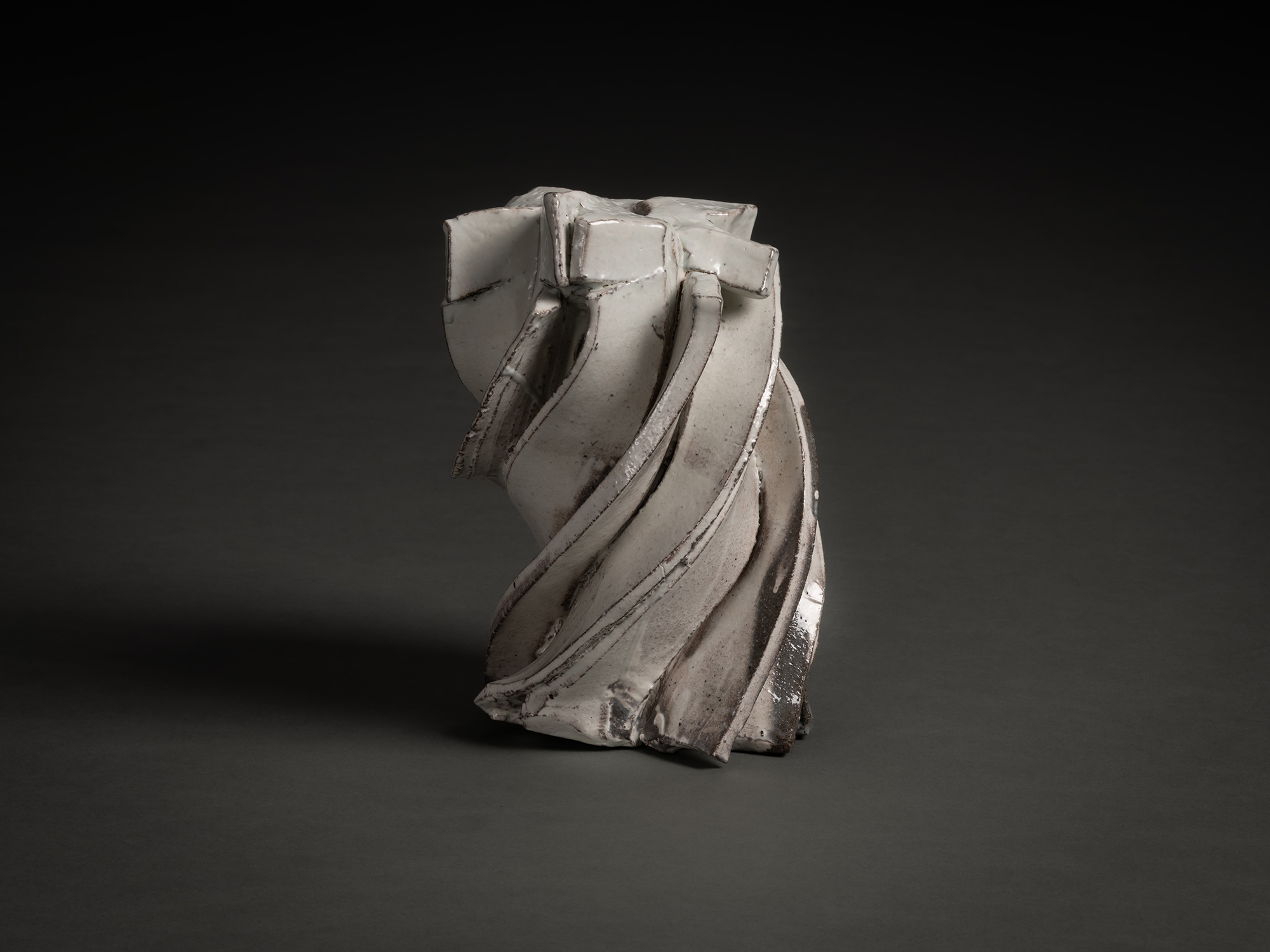 Kohiki Sculptural Form by Shōzō Michikawa is a vertically twisting ceramic sculpture with layered...