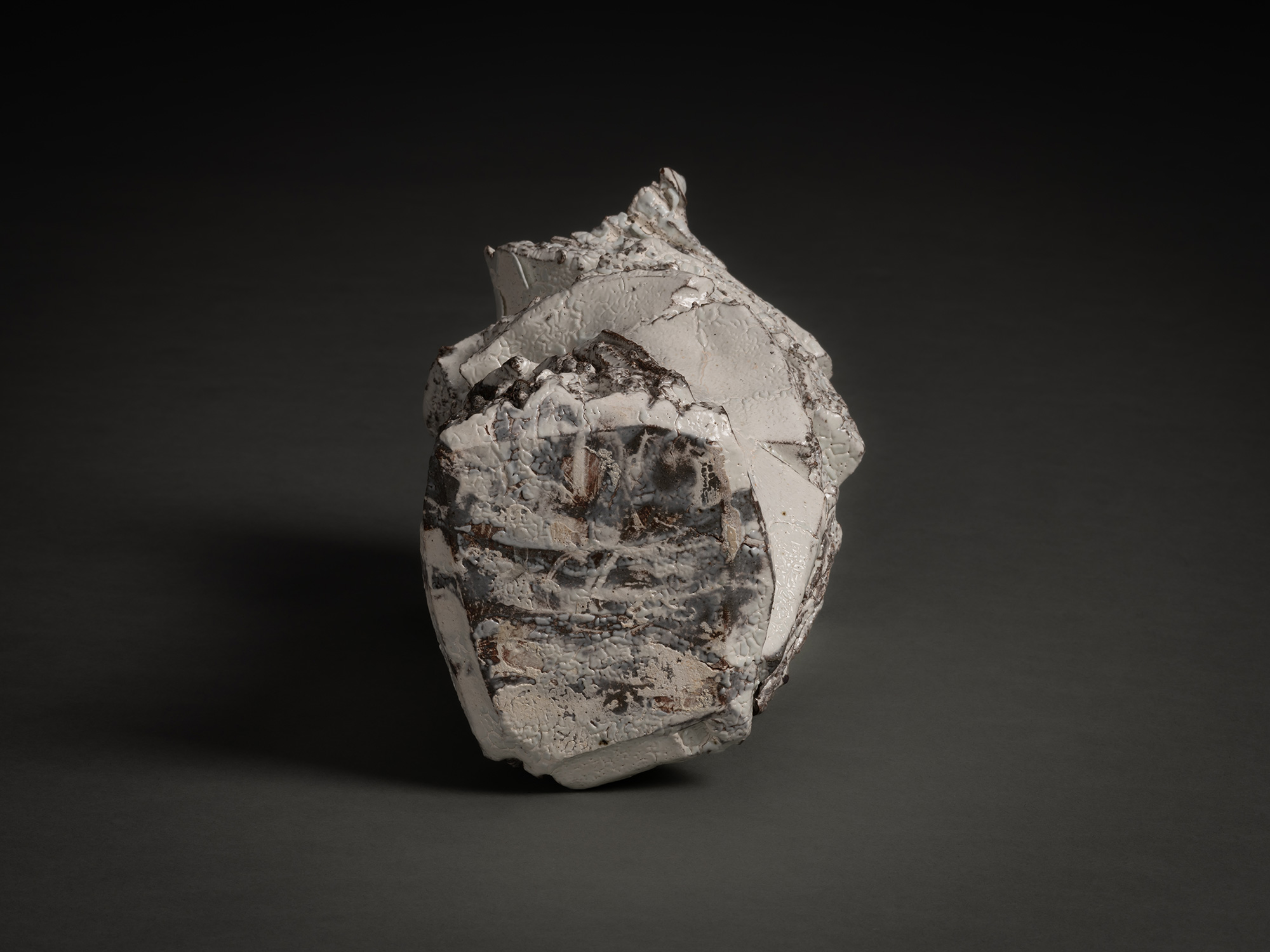 Foot view of Kohiki Sculptural Form by Shōzō Michikawa showing a rough, irregular base with layered...