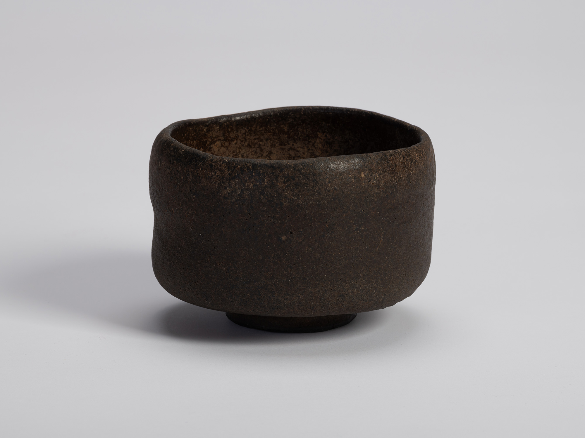 Raku tea bowl entitled Musashino by Chōjirō, a hand-formed black chawan with thick rounded walls...