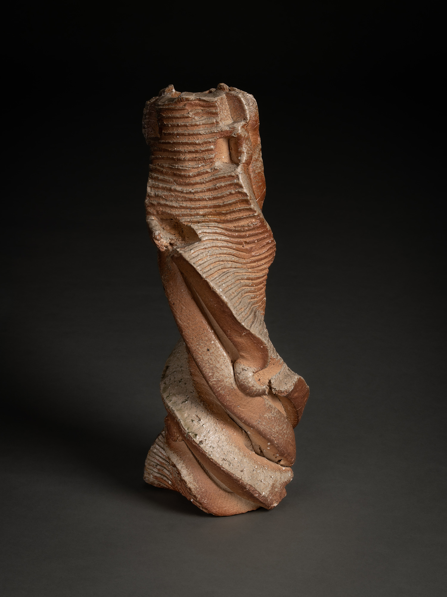 Natural ash sculptural form by Shōzō Michikawa featuring a tall twisting ceramic structure with...