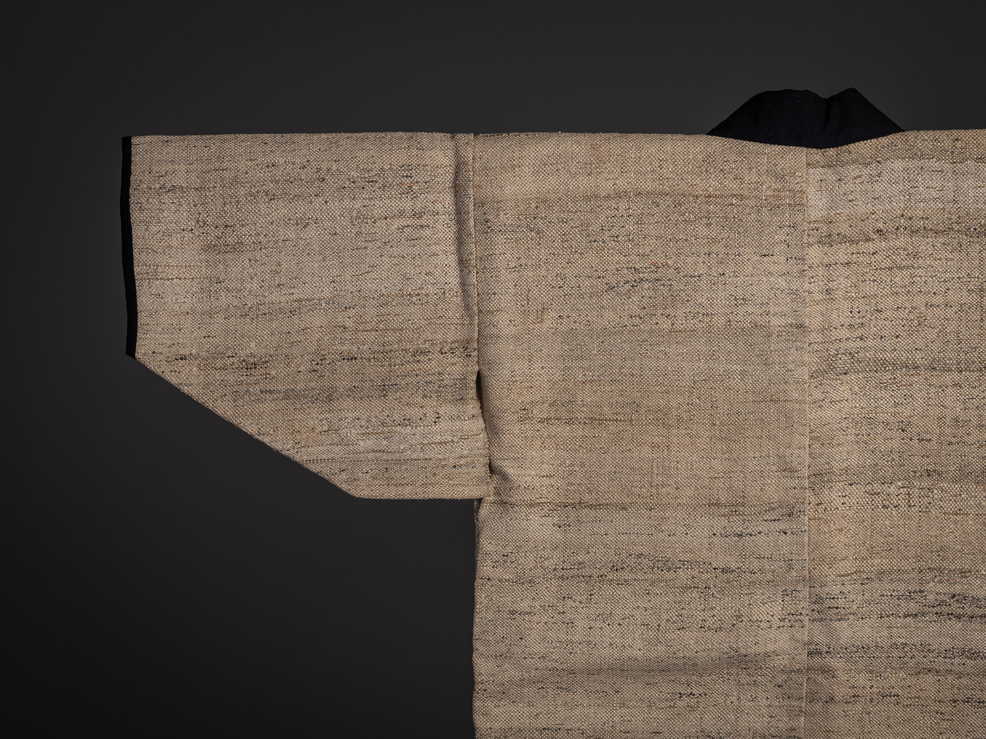 Close-up of the sleeve and shoulder area of a Japanese ōtsuzure hanten woven from wisteria yarn...