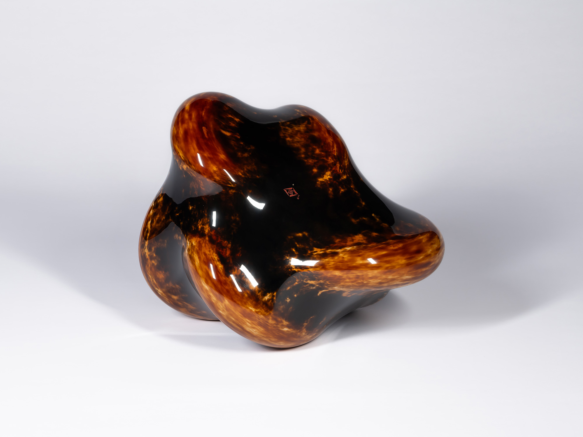 The underside or bottom view of the freestanding lacquer sculpture Taxis Groove - Soft Ridges by...