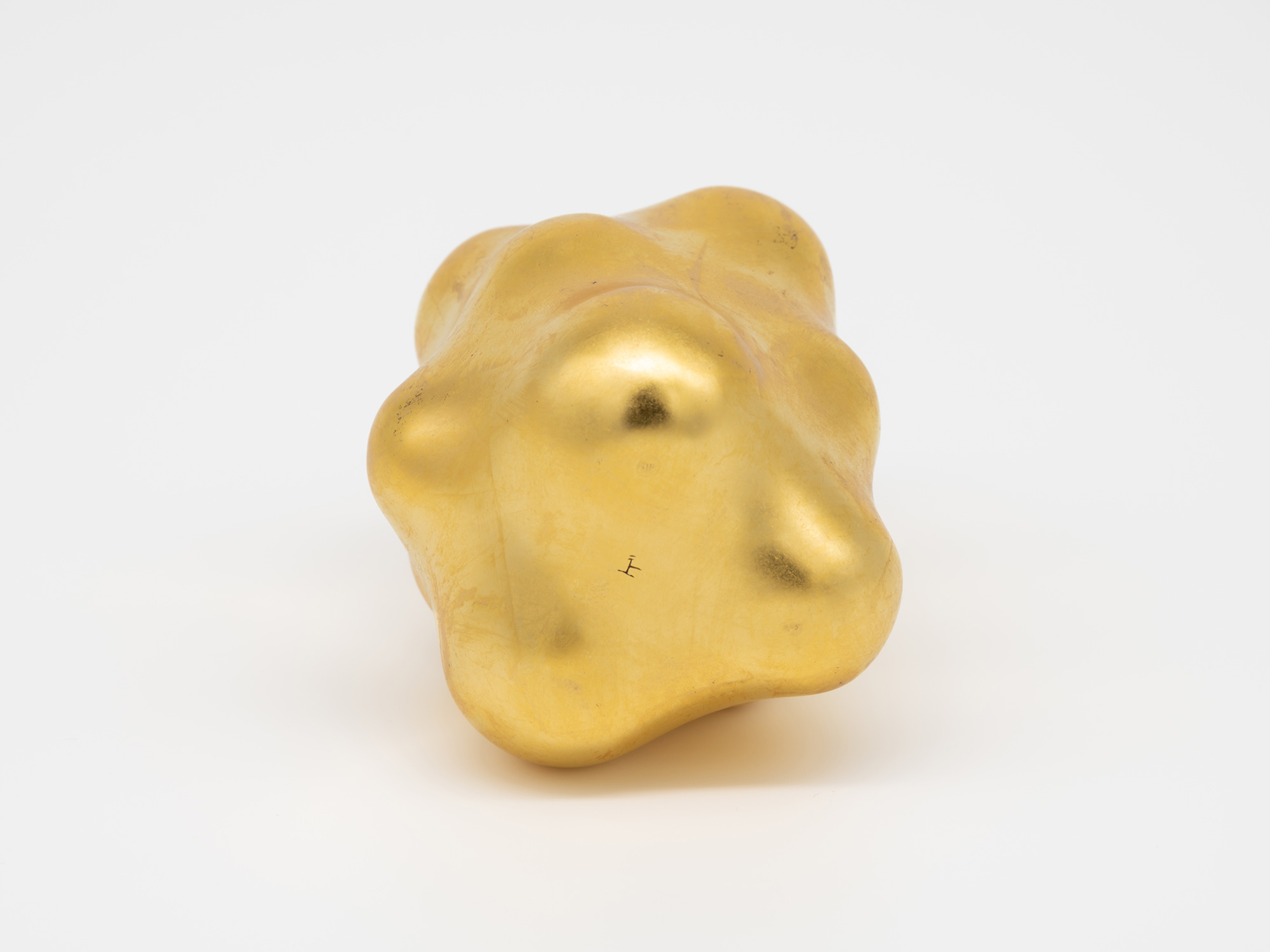 The underside view of the sculpture Untitled by Genta Ishizuka, documenting the multi-lobed base...