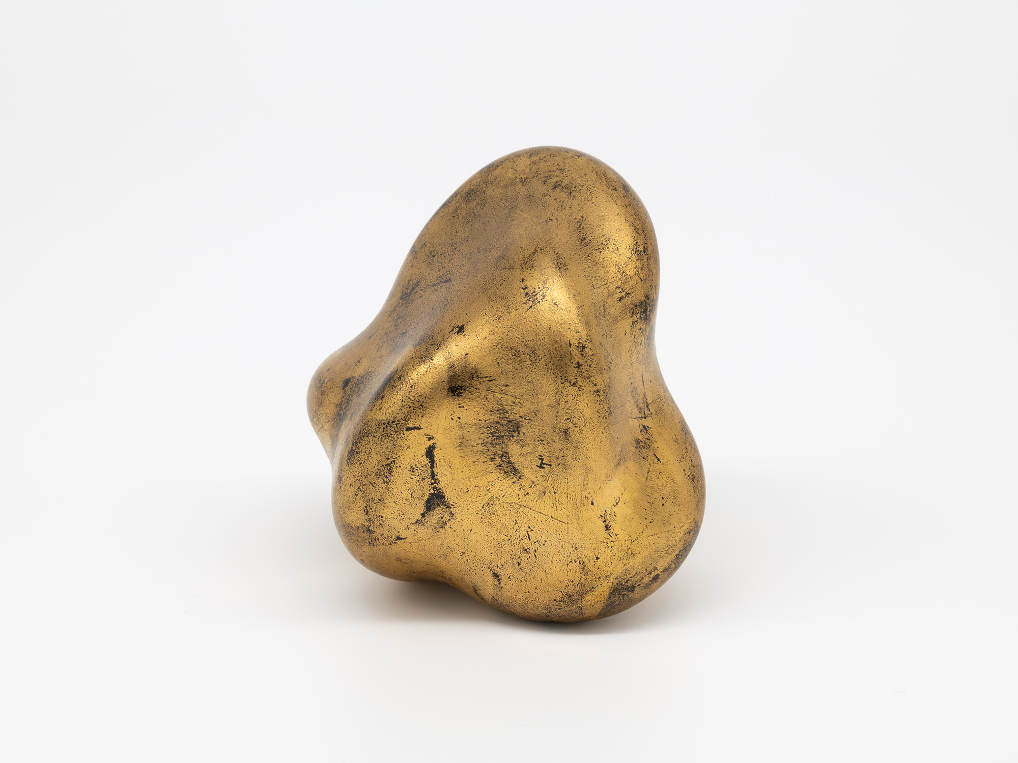 The underside view of Genta Ishizuka's freestanding sculpture Untitled (faded-gold), showing the...