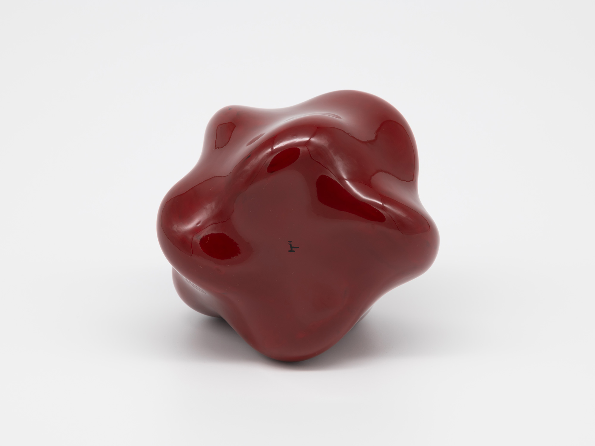 The underside view of Genta Ishizuka's Untitled (star) sculpture shows the base configuration against...