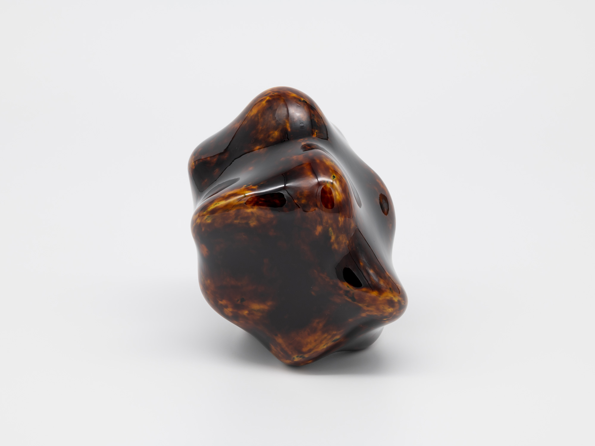 The underside view of Genta Ishizuka's Untitled (tangled) sculpture reveals a highly polished base...